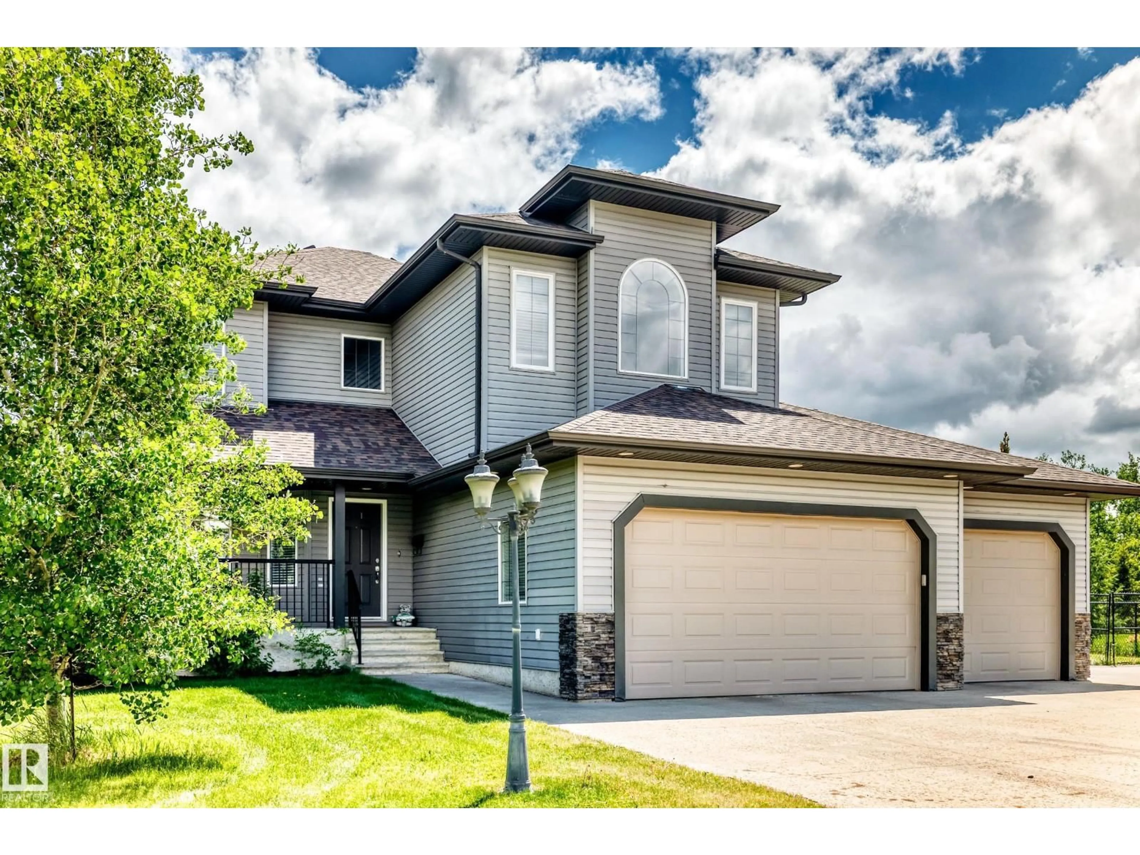 Home with vinyl exterior material, street for 59 53305 RGE ROAD 273, Rural Parkland County Alberta T7X3K2