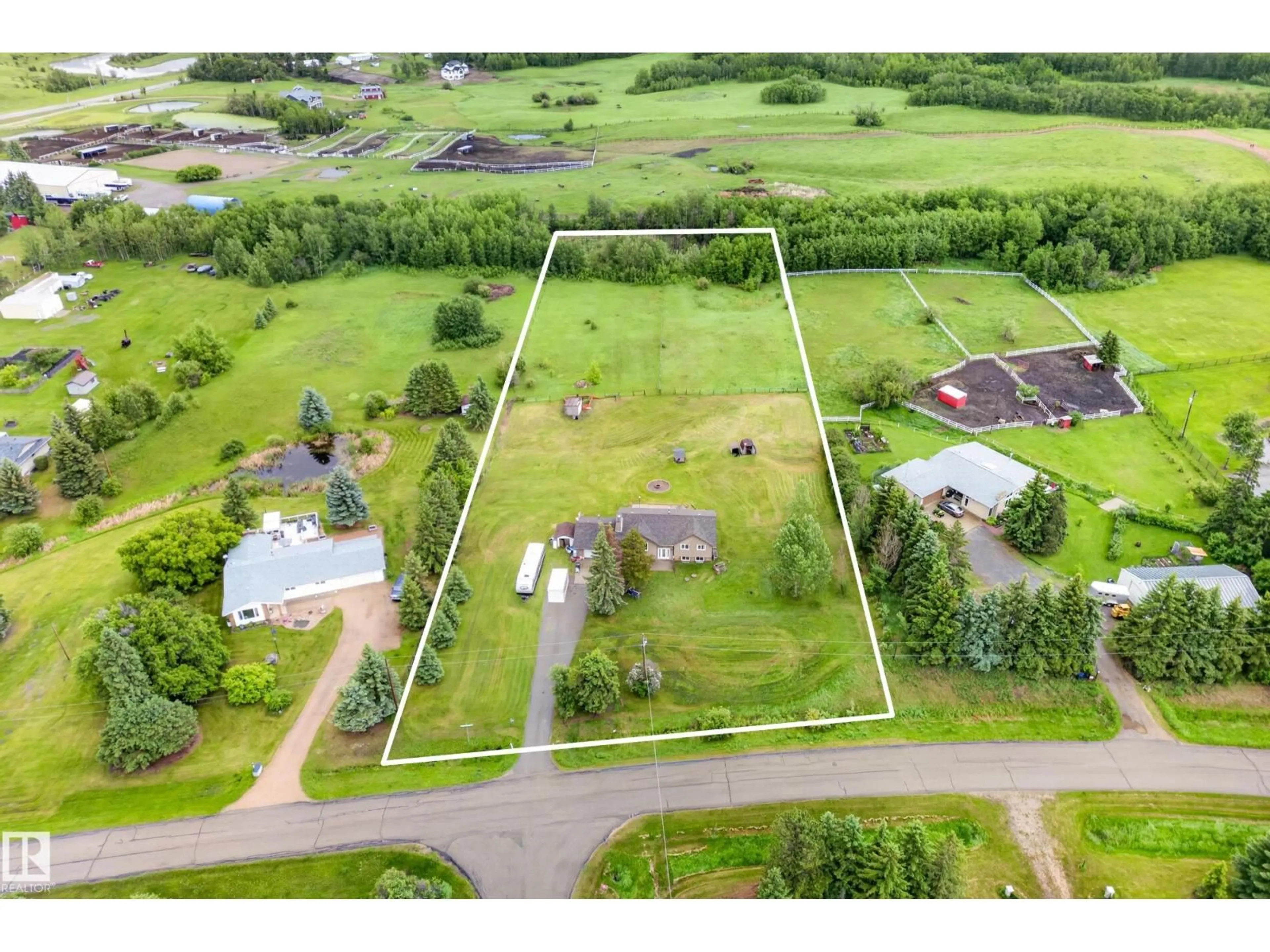 A pic from outside/outdoor area/front of a property/back of a property/a pic from drone, unknown for 51561 - 217 RGE ROAD 224, Rural Strathcona County Alberta T8C1H5