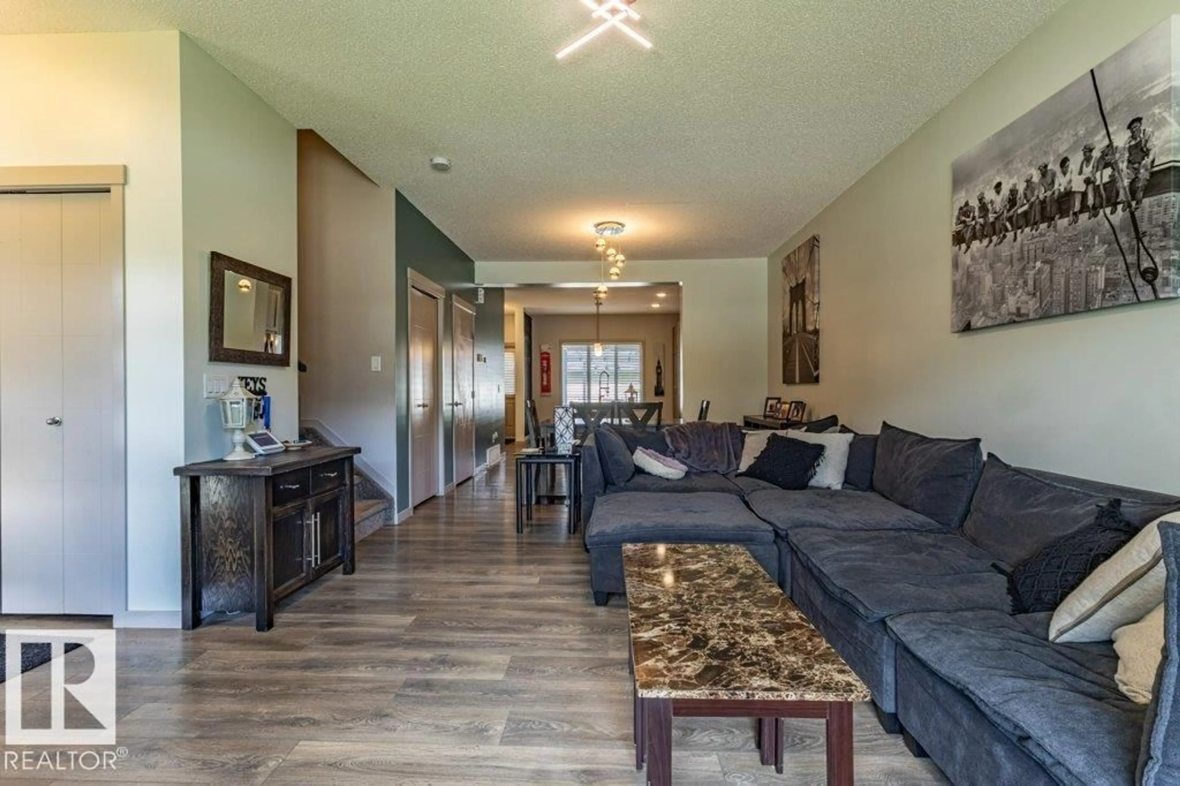 Living room with furniture, wood/laminate floor for NW - 17123 49 ST, Edmonton Alberta T5Y3P6