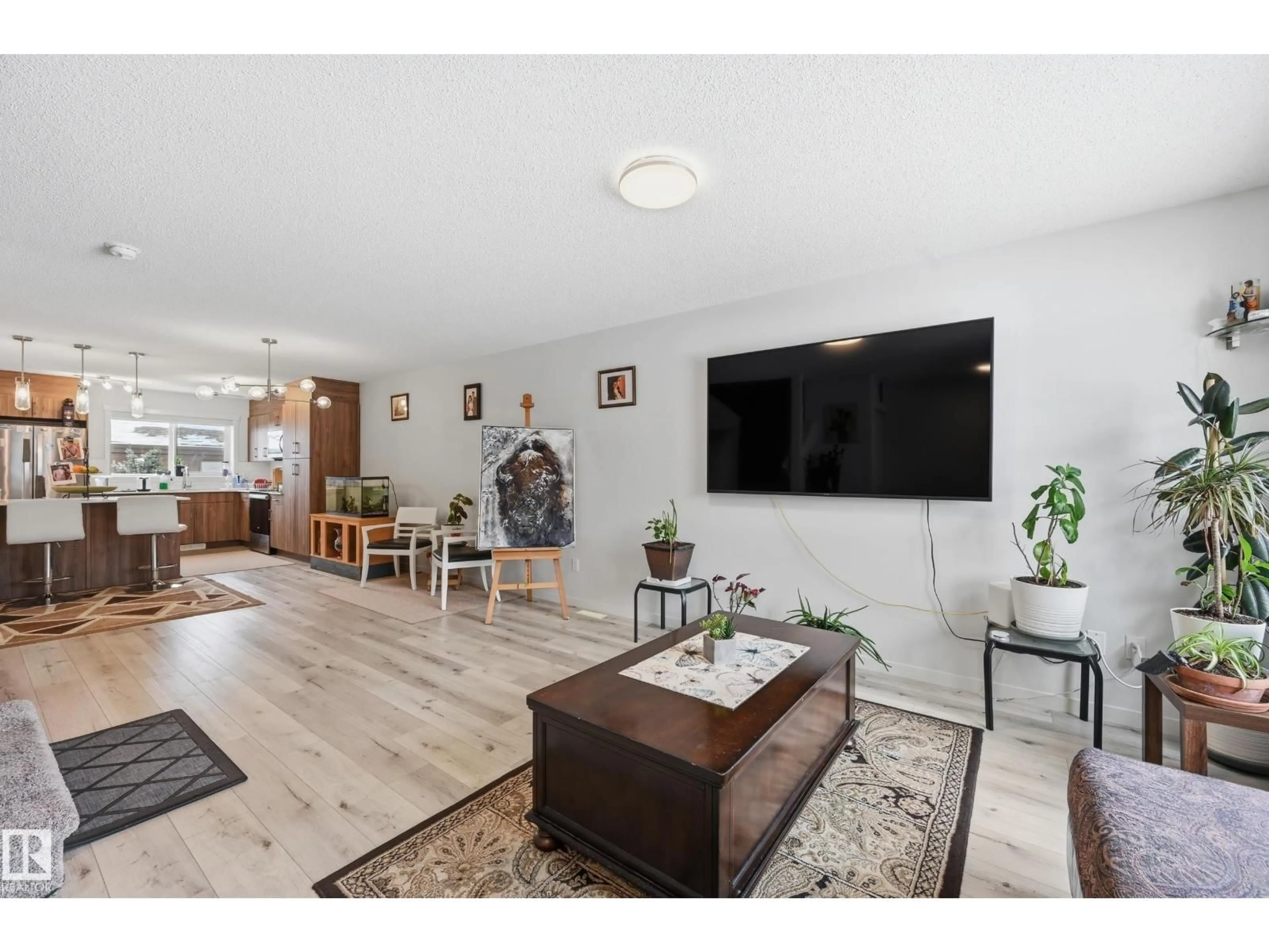 Living room with furniture, wood/laminate floor for 2608 201 STREET, Edmonton Alberta T6M1K5
