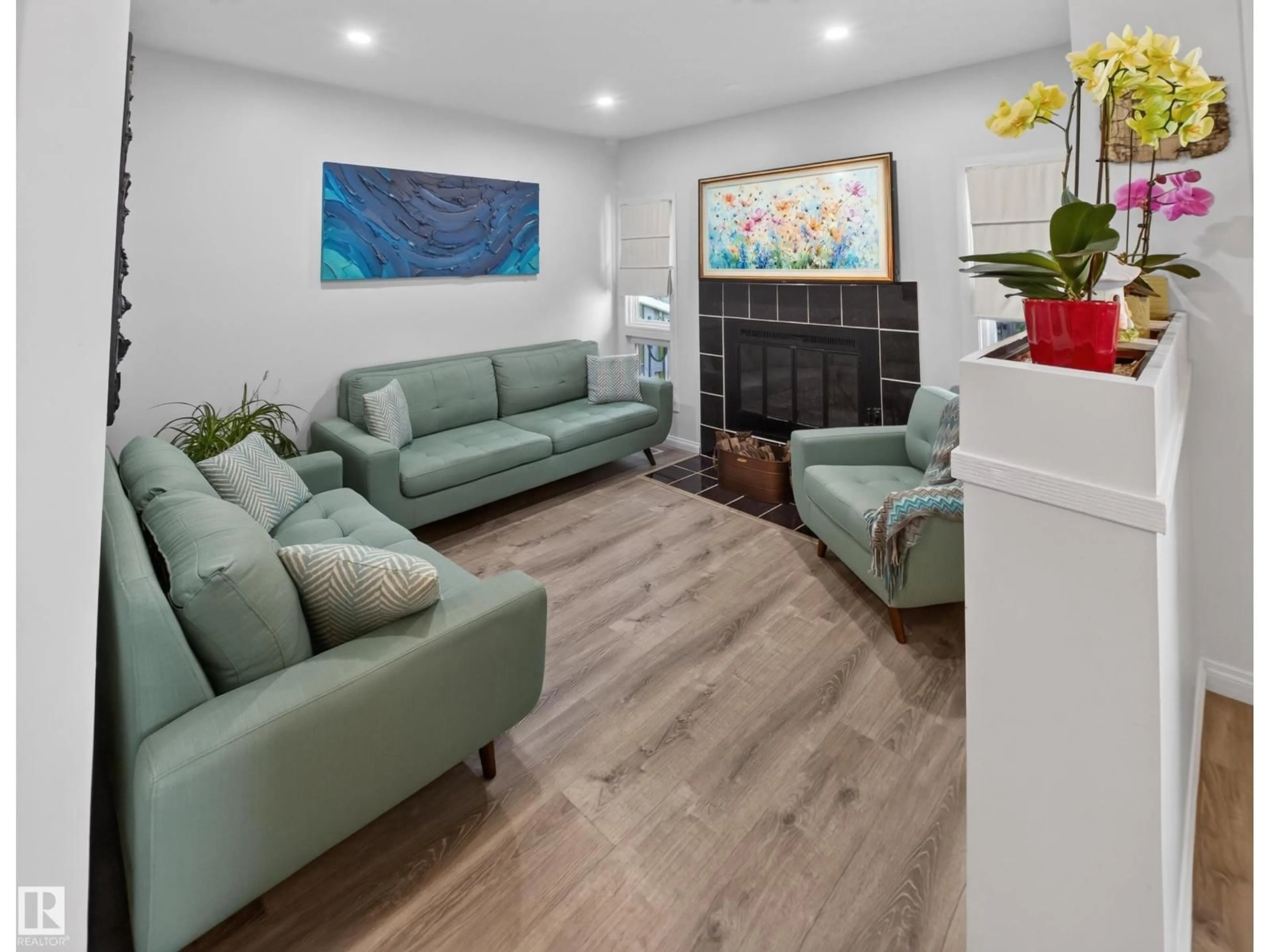 Living room with furniture, wood/laminate floor for #17 - 15710 BEAUMARIS RD, Edmonton Alberta T5X5E2