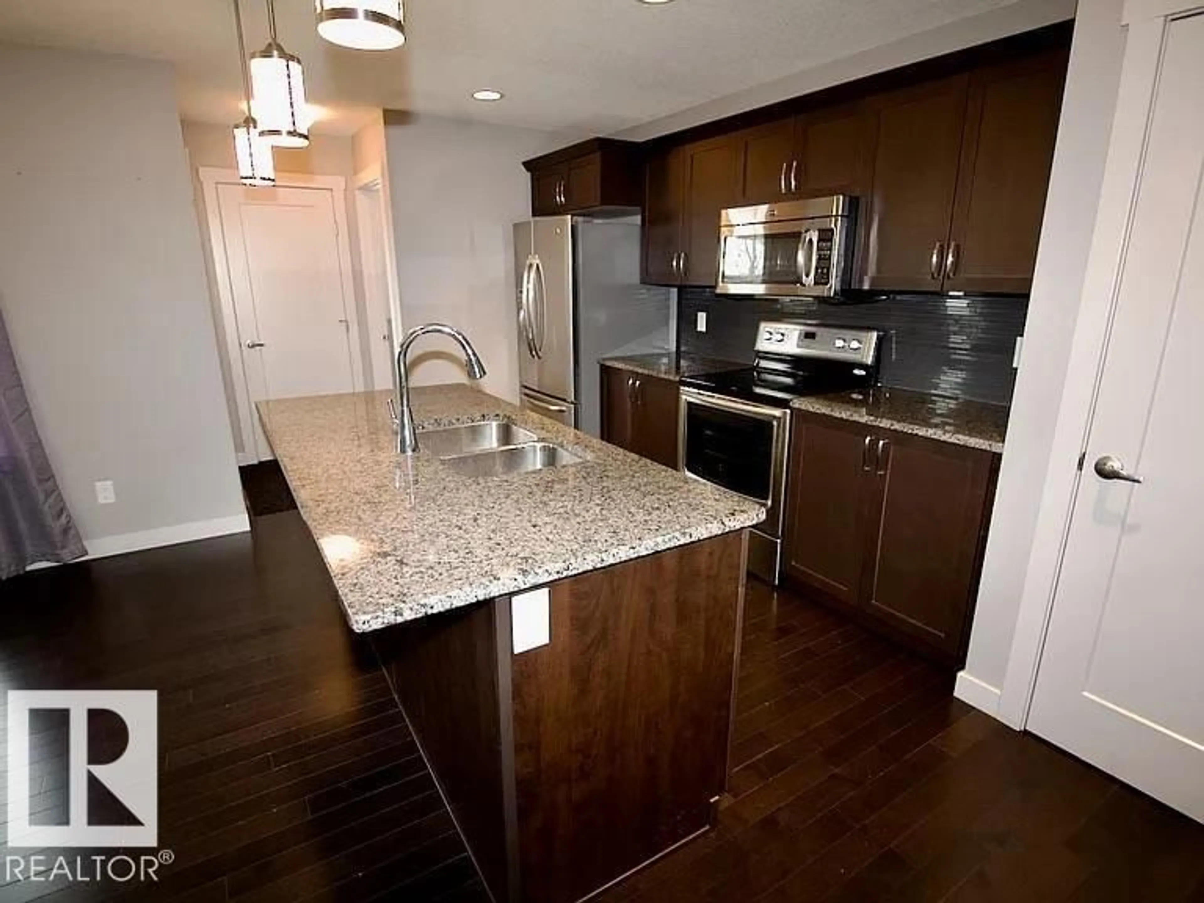 Open concept kitchen, wood/laminate floor for 29 SANTANA, Fort Saskatchewan Alberta T8L0N7
