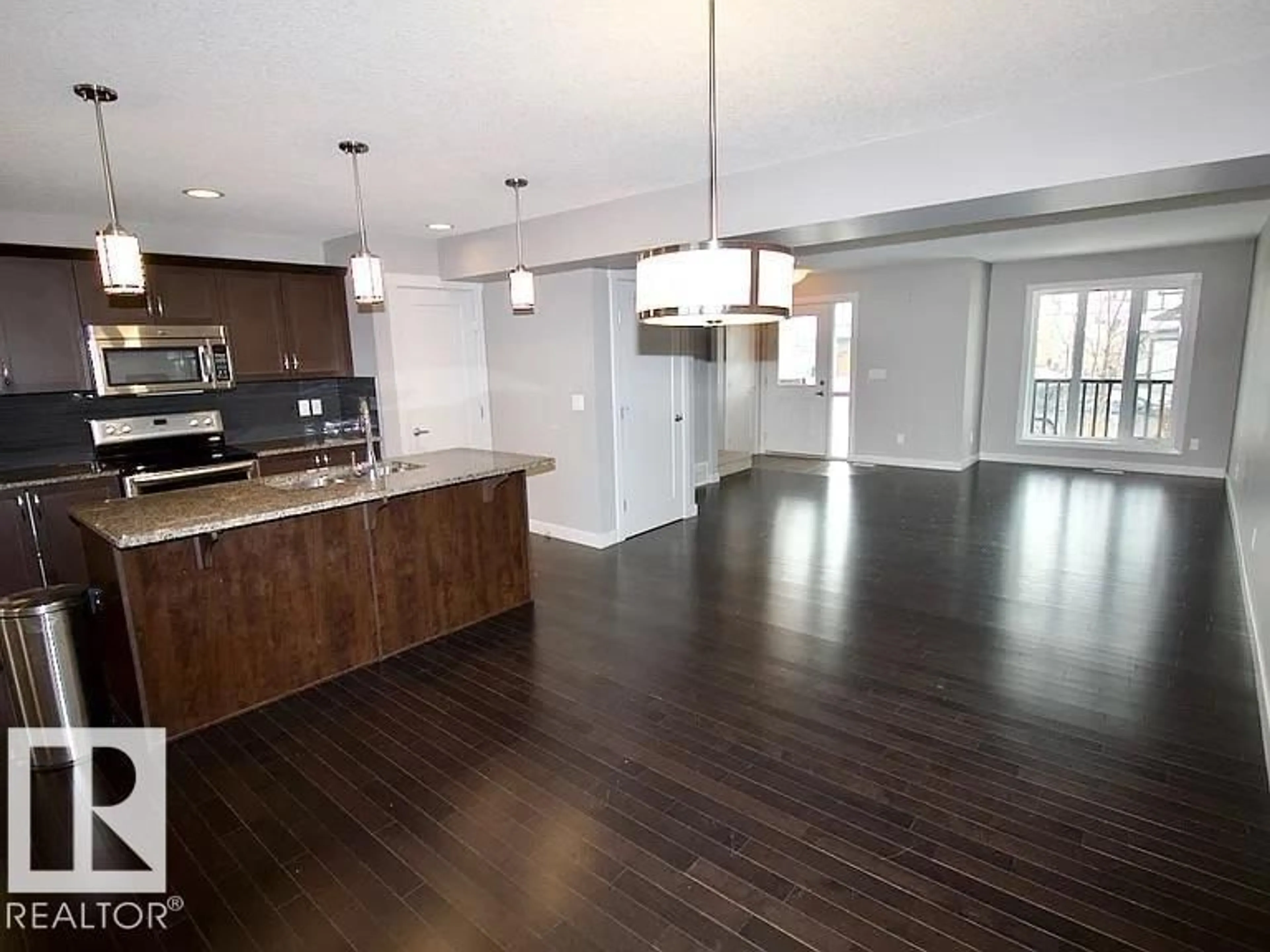 Open concept kitchen, wood/laminate floor for 29 SANTANA, Fort Saskatchewan Alberta T8L0N7