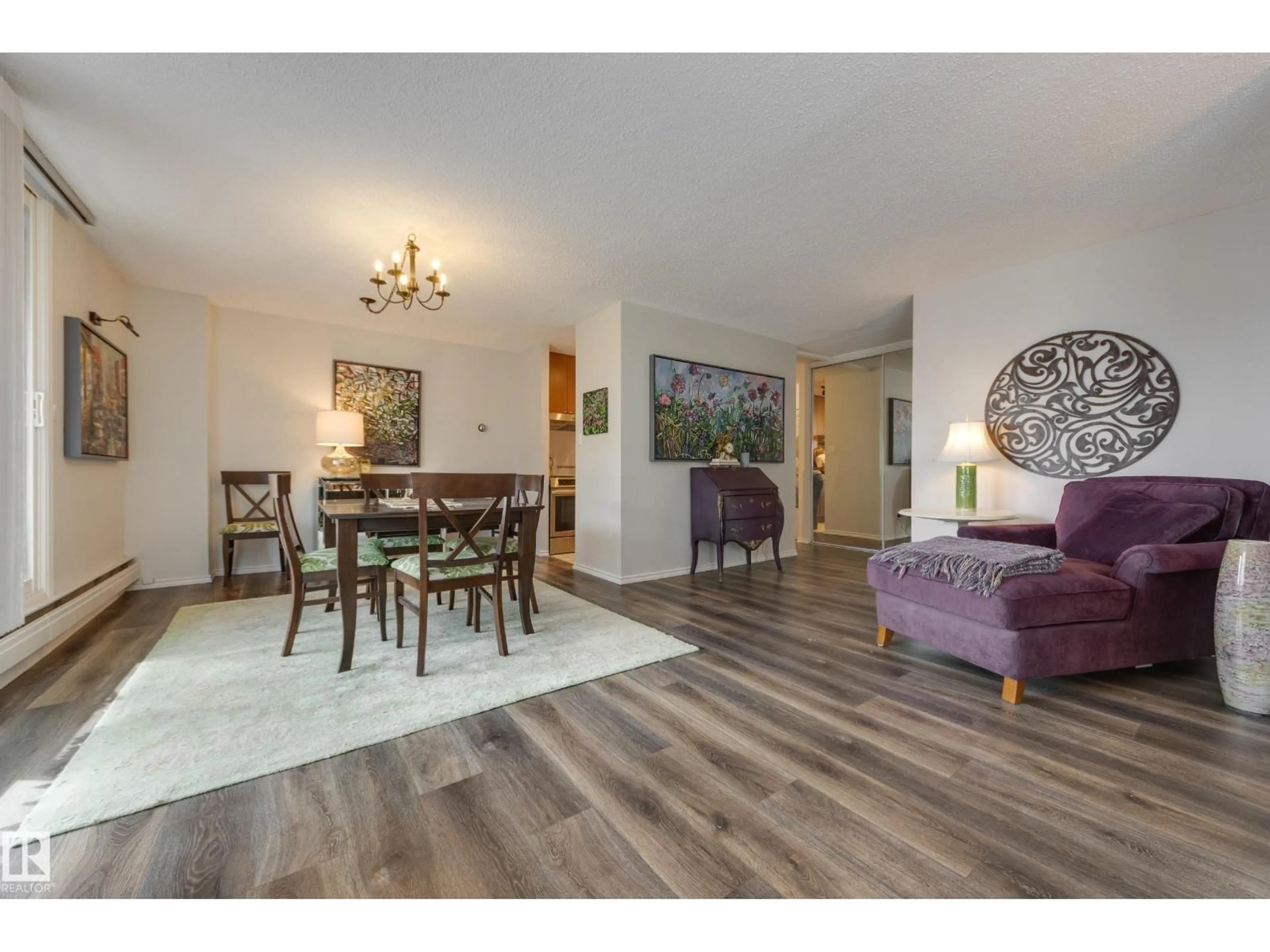 Living room with furniture, wood/laminate floor for 9909 110 ST, Edmonton Alberta T5K2E5
