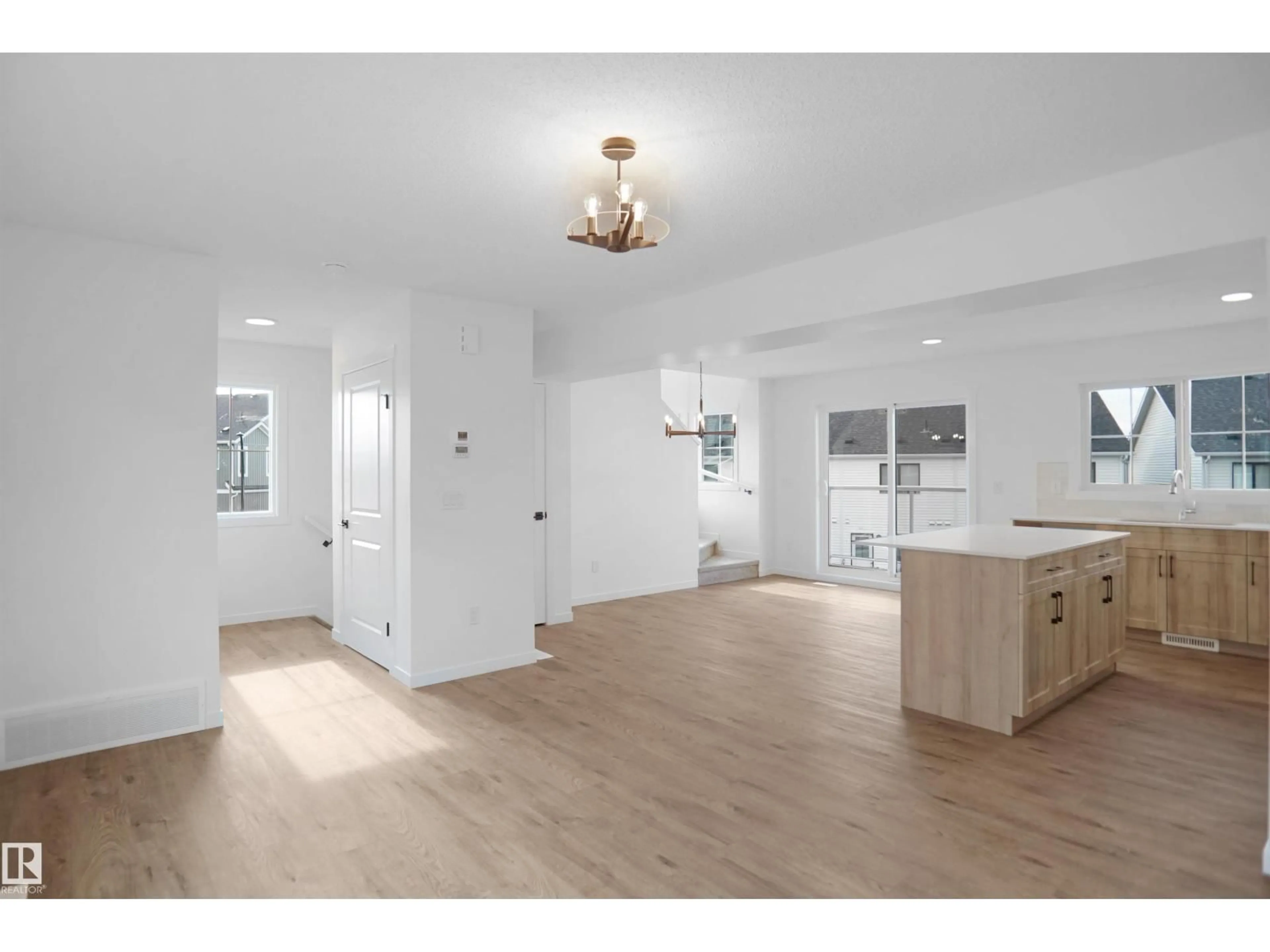 Open concept kitchen, wood/laminate floor for 65 SECORD BV, Edmonton Alberta T5T7V3