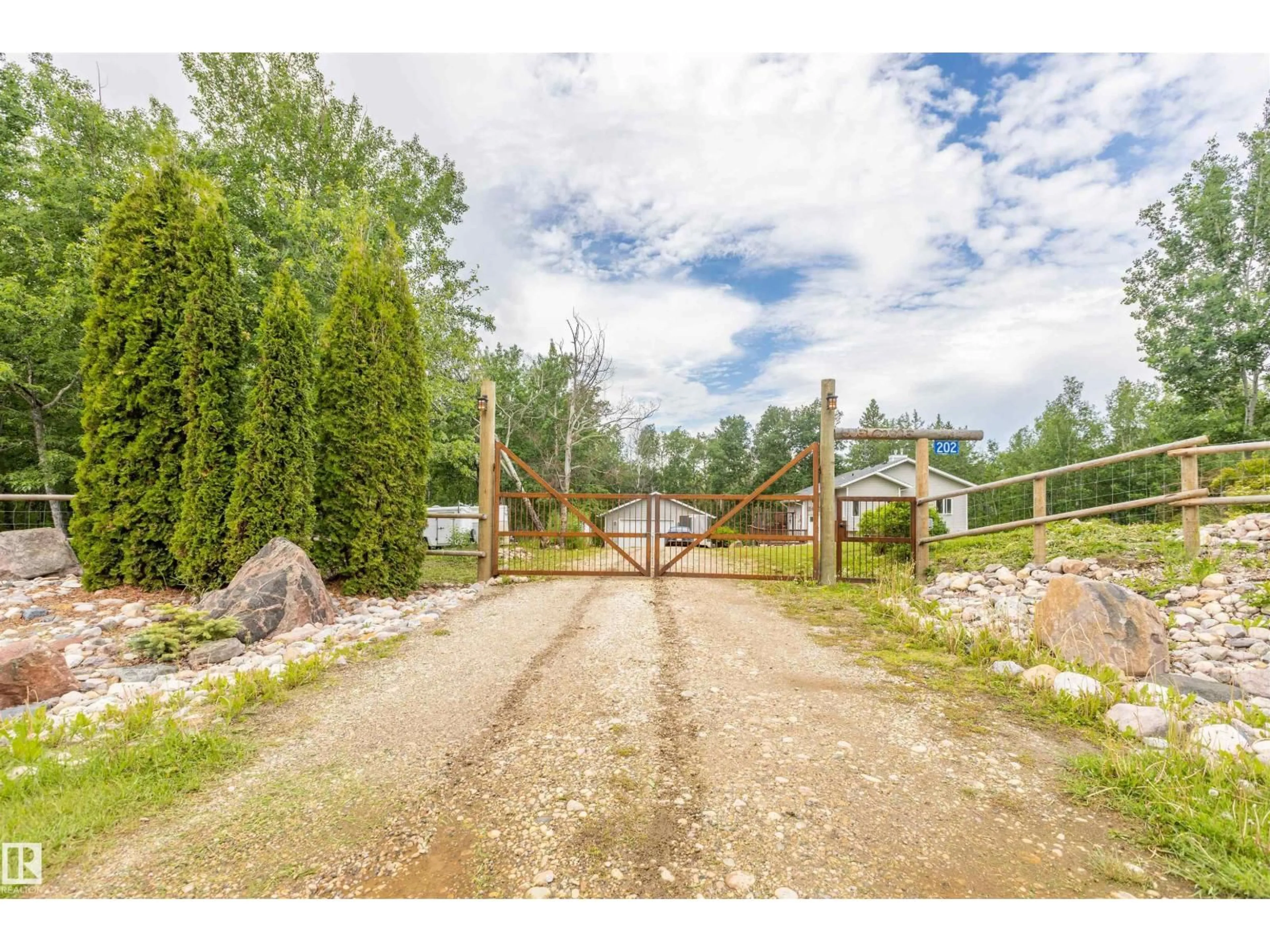 A pic from outside/outdoor area/front of a property/back of a property/a pic from drone, unknown for 202 - 55109 HWY 777, Rural Lac Ste. Anne County Alberta T0E1V0