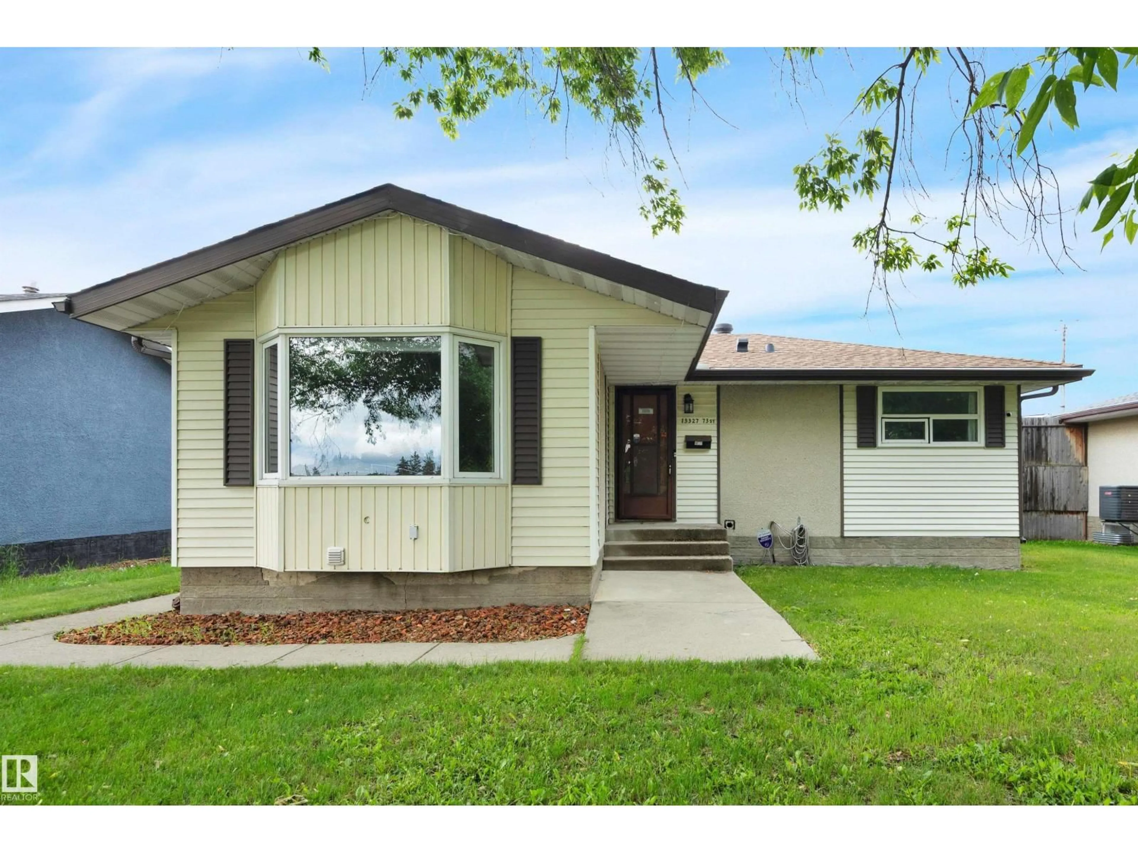 Home with vinyl exterior material, street for 13327 73 ST, Edmonton Alberta T5C0T7