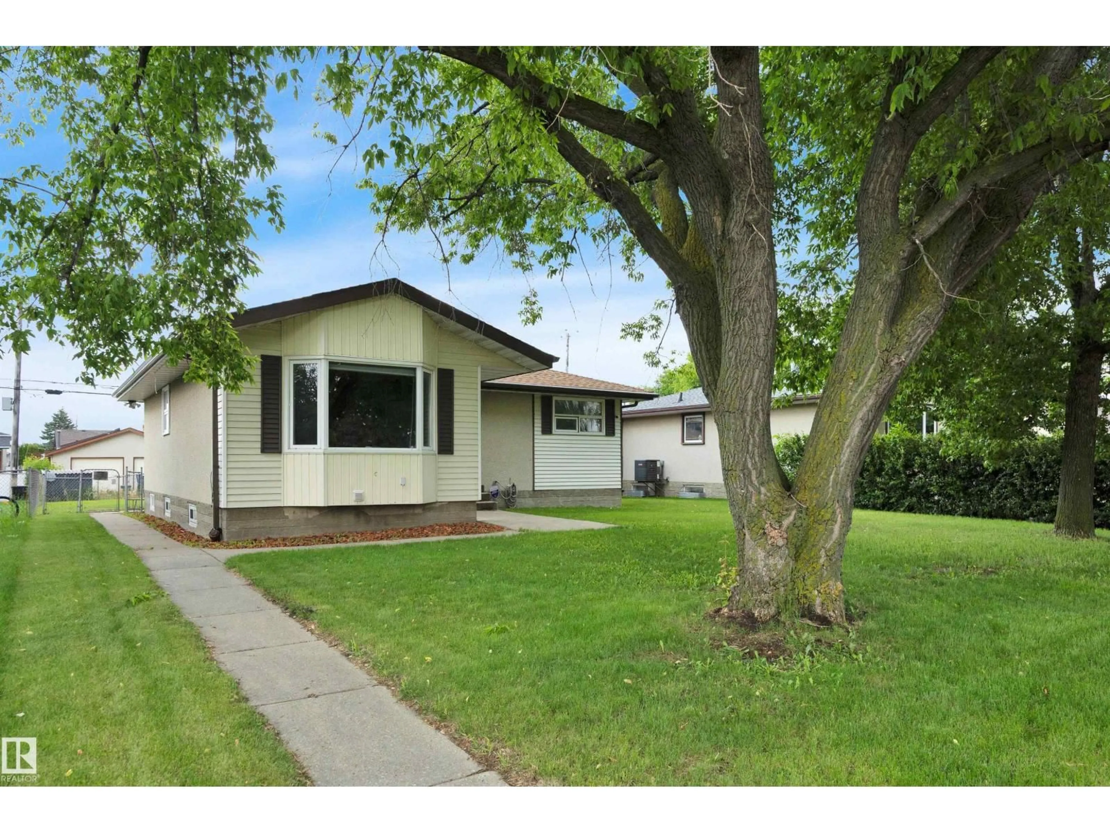 Home with vinyl exterior material, street for 13327 73 ST, Edmonton Alberta T5C0T7