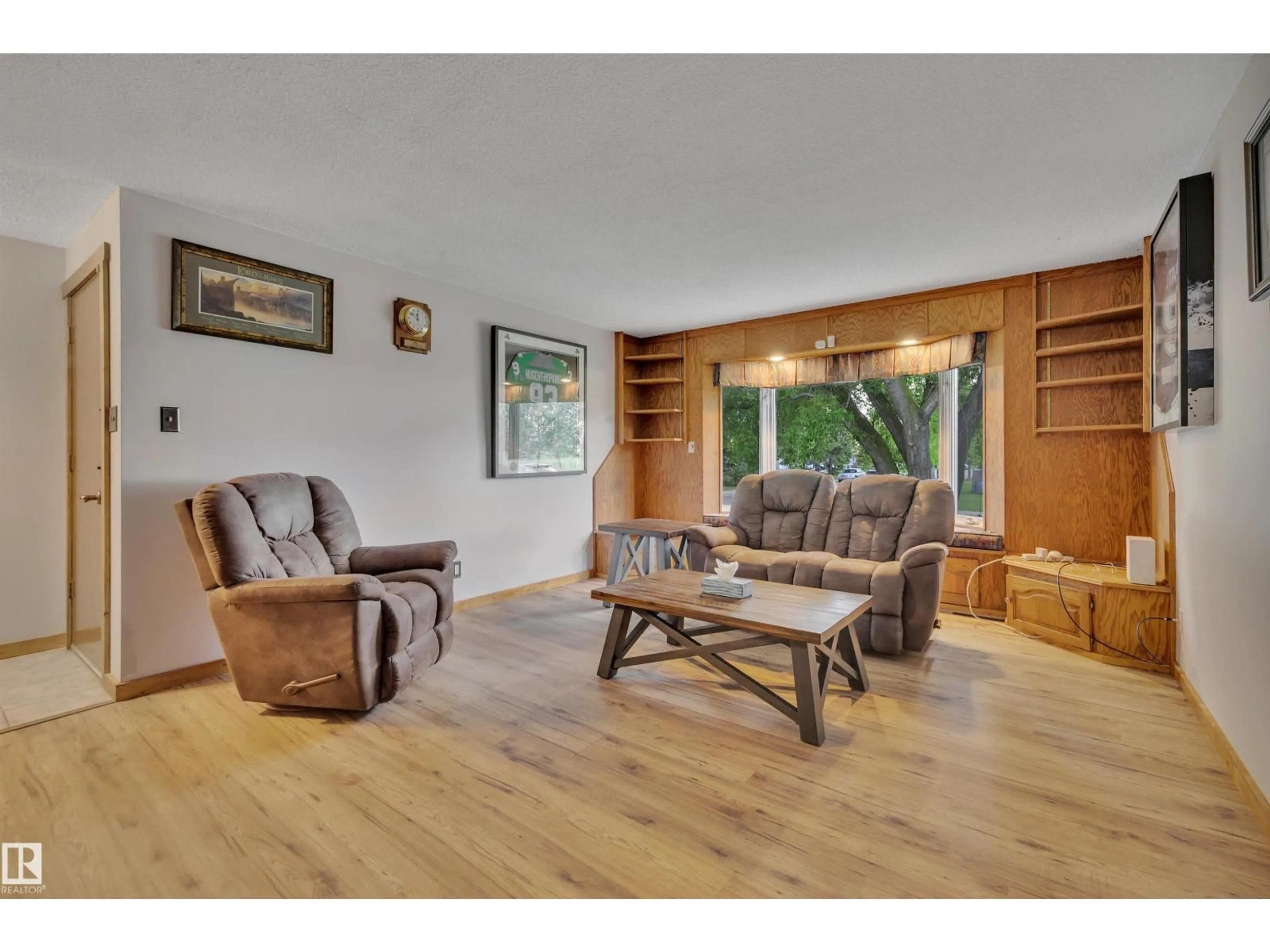 Living room with furniture, wood/laminate floor for 13327 73 ST, Edmonton Alberta T5C0T7