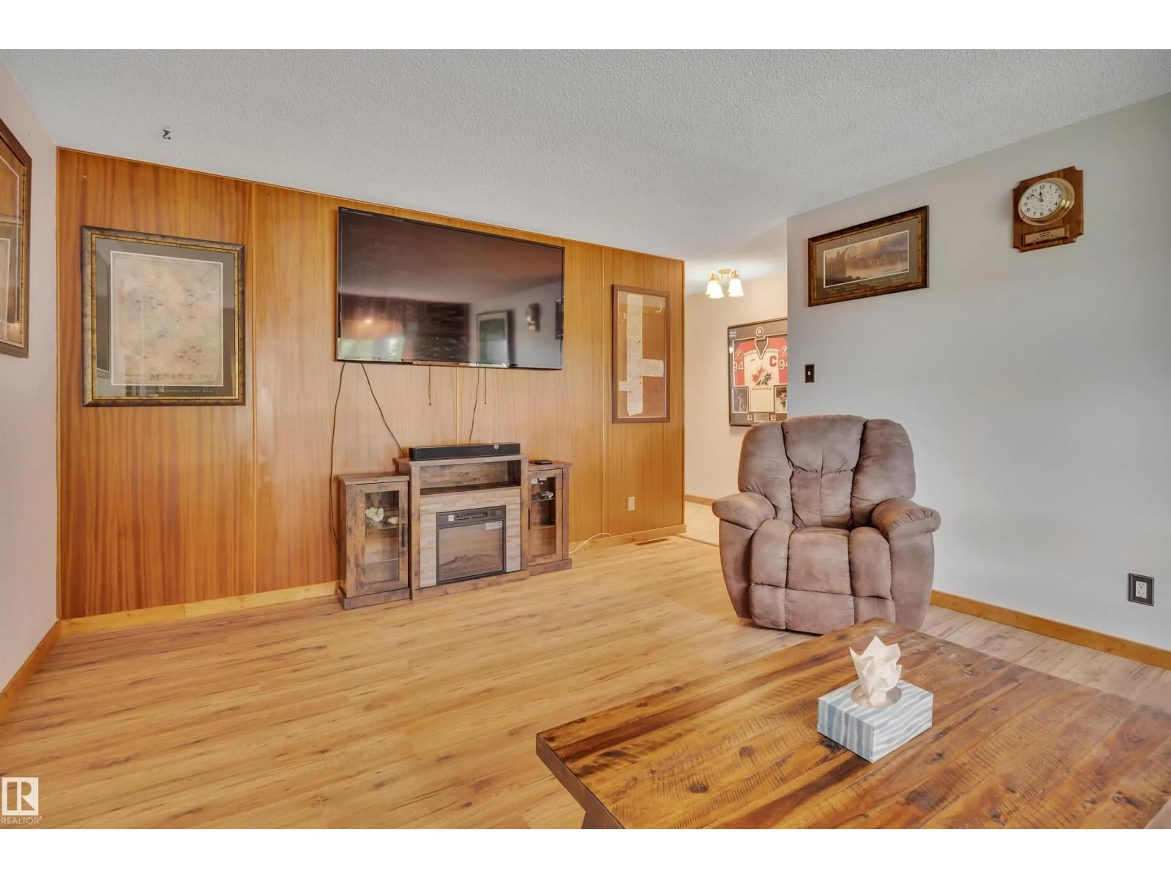 Living room with furniture, wood/laminate floor for 13327 73 ST, Edmonton Alberta T5C0T7