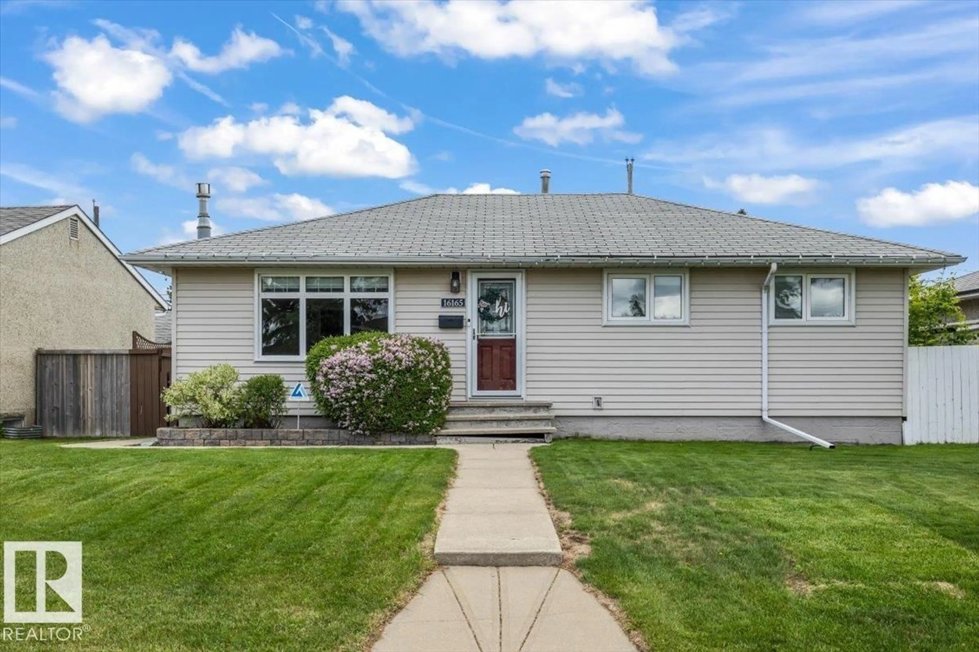 Home with vinyl exterior material, street for NW - 16165 110B AV, Edmonton Alberta T5P1J6