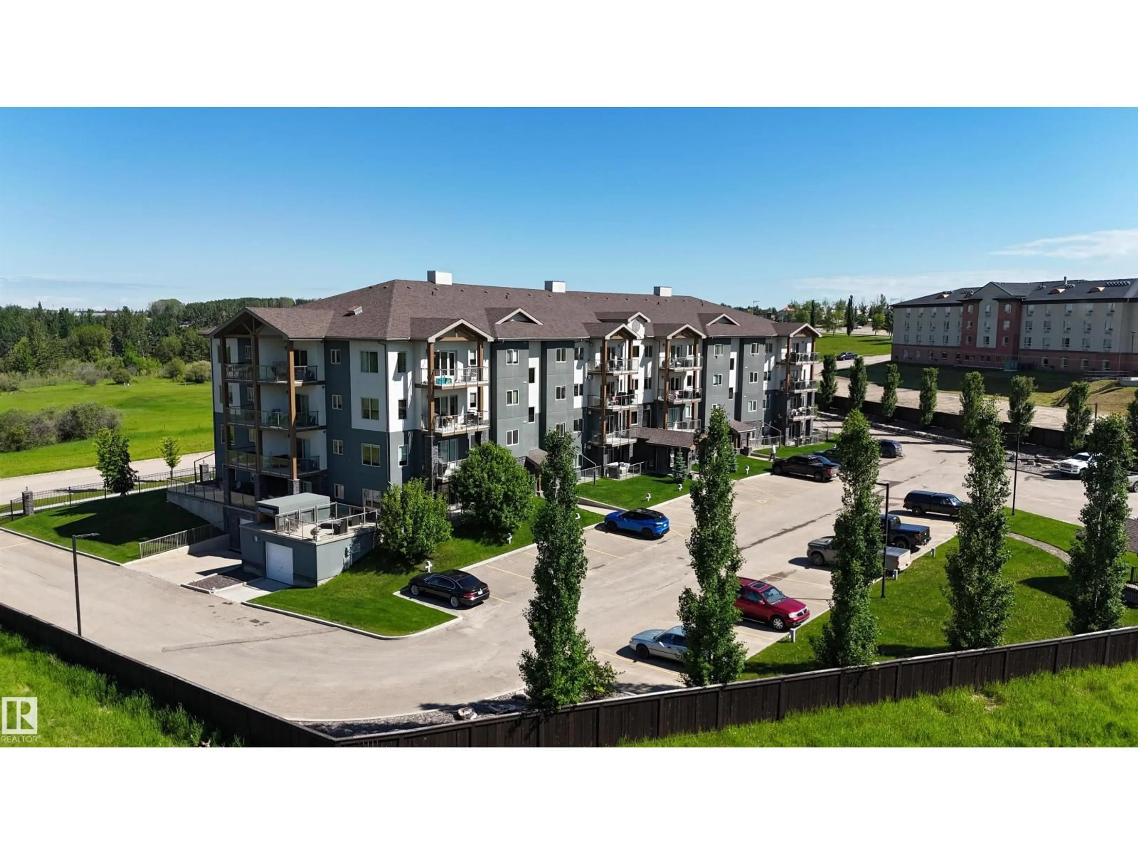 A pic from outside/outdoor area/front of a property/back of a property/a pic from drone, building for 202 - 5201 BROUGHAM DR, Drayton Valley Alberta T7A0A1