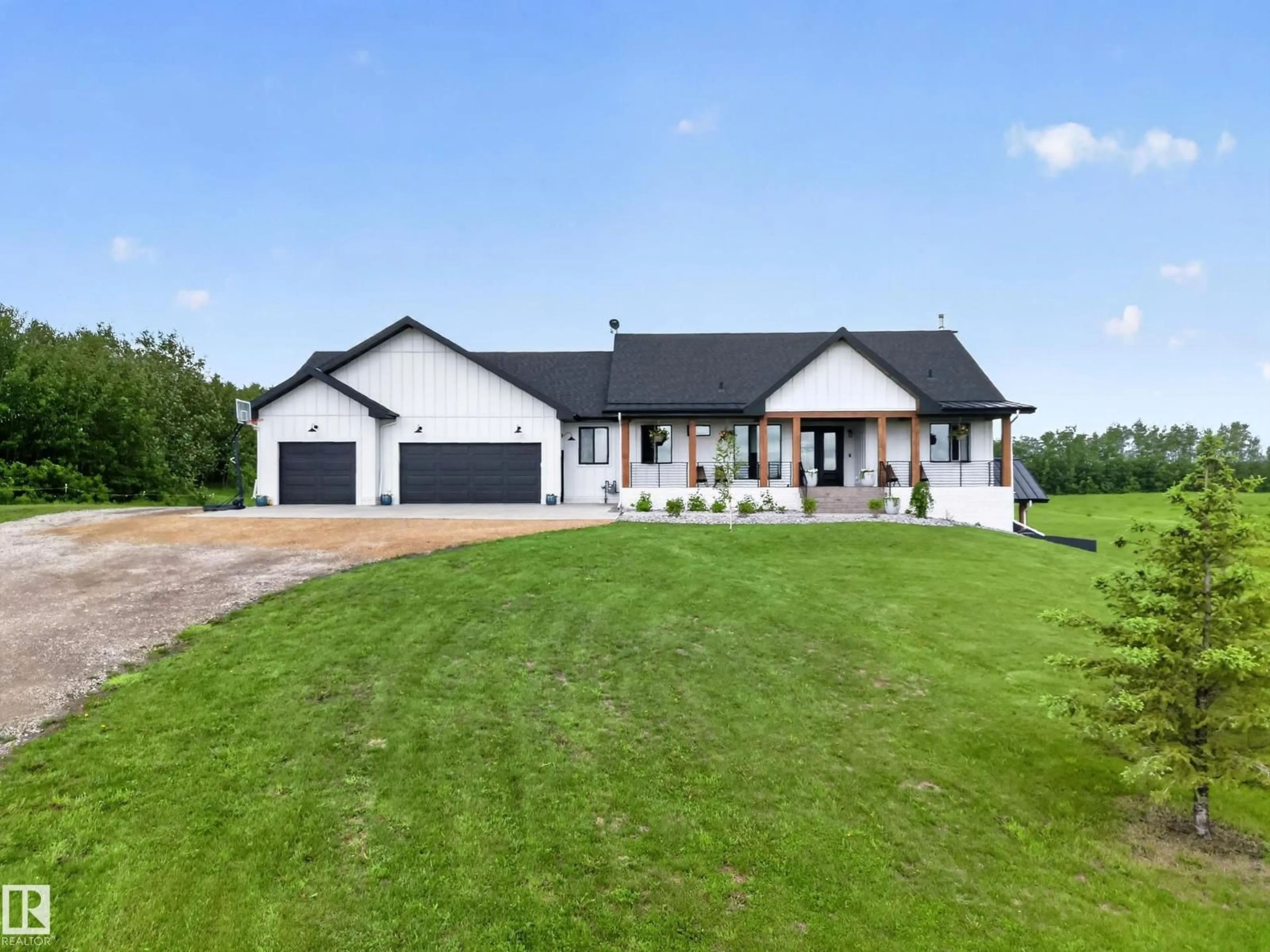 A pic from outside/outdoor area/front of a property/back of a property/a pic from drone, street for 155 22111 TWP ROAD 510, Rural Leduc County Alberta T0B3M2