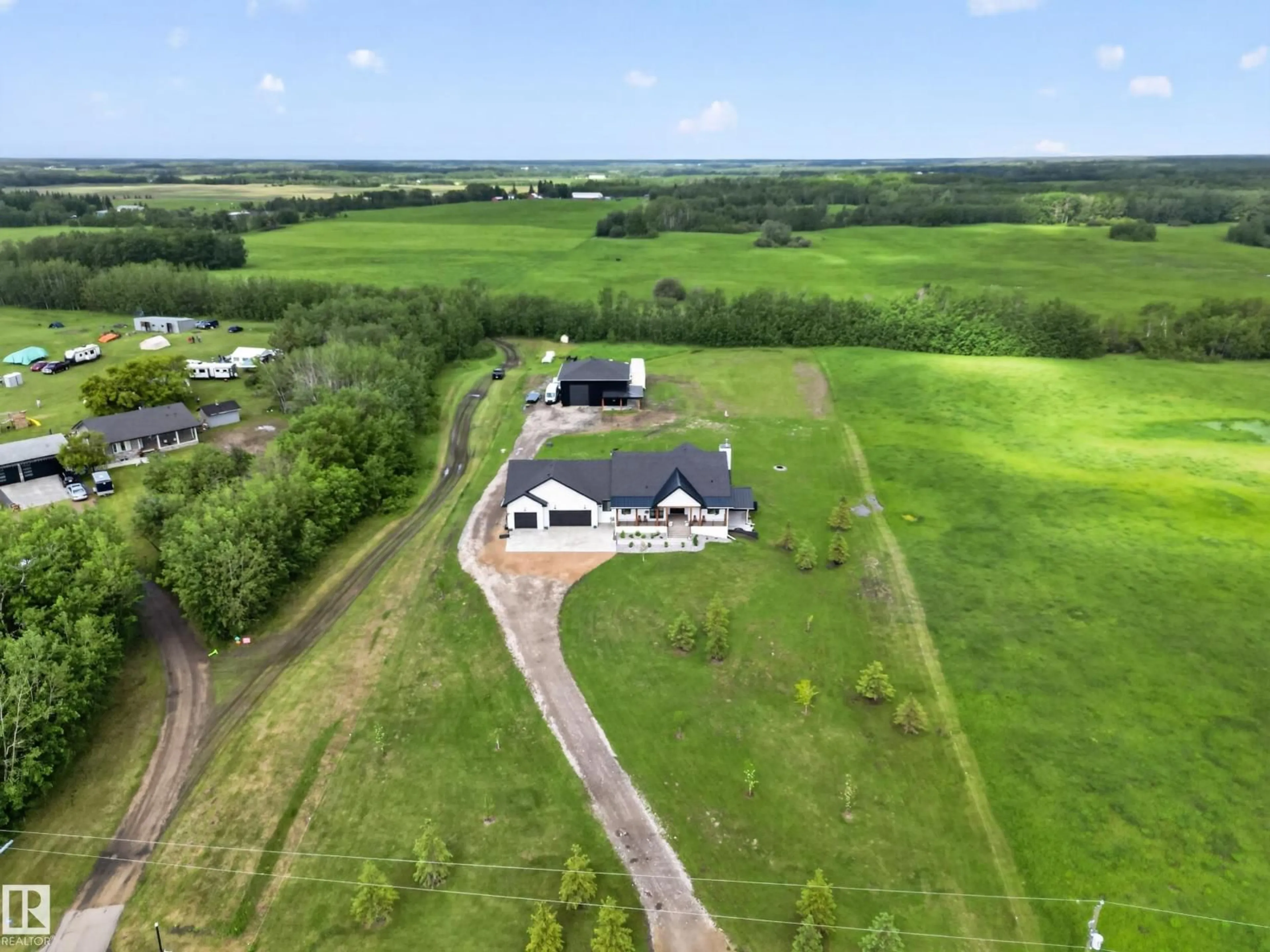 A pic from outside/outdoor area/front of a property/back of a property/a pic from drone, building for 155 22111 TWP ROAD 510, Rural Leduc County Alberta T0B3M2