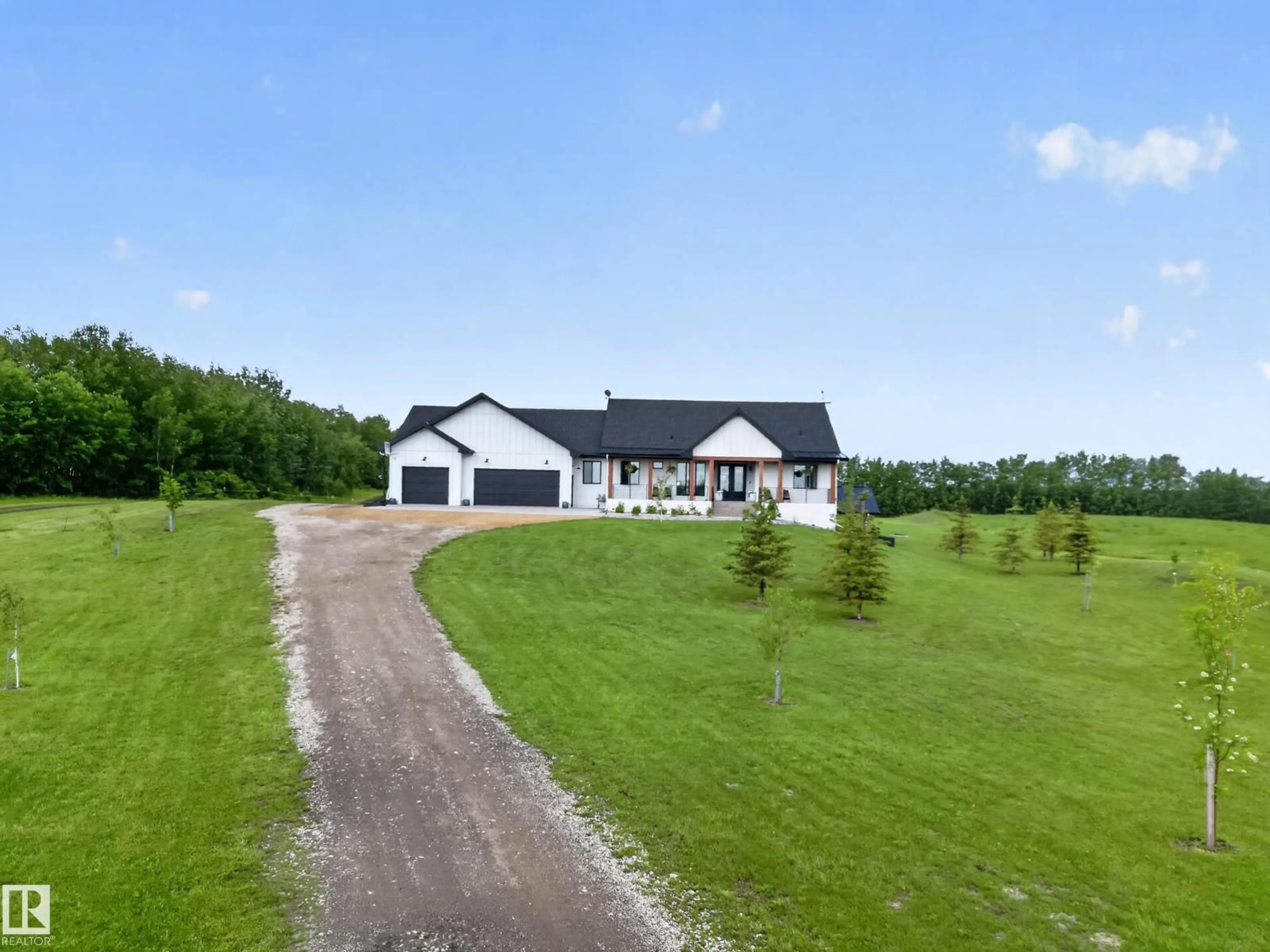 A pic from outside/outdoor area/front of a property/back of a property/a pic from drone, unknown for 155 22111 TWP ROAD 510, Rural Leduc County Alberta T0B3M2