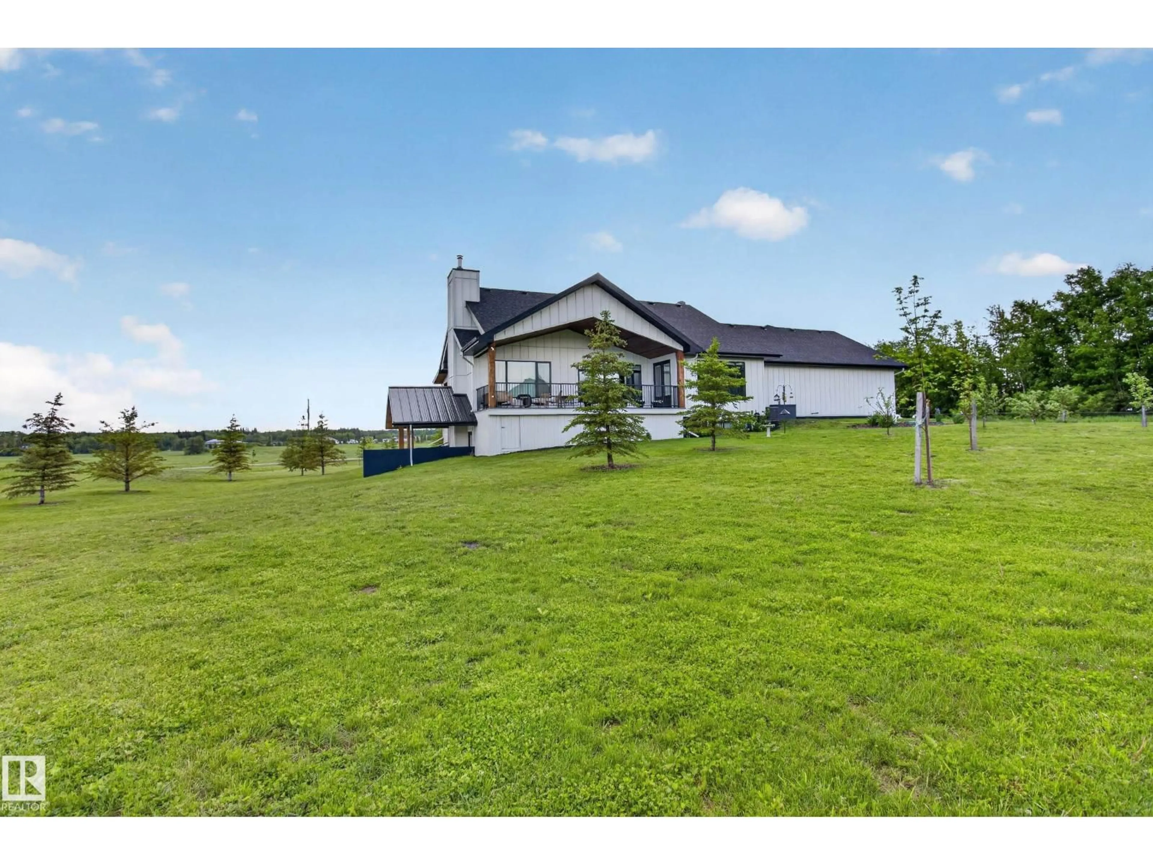 A pic from outside/outdoor area/front of a property/back of a property/a pic from drone, building for 155 22111 TWP ROAD 510, Rural Leduc County Alberta T0B3M2