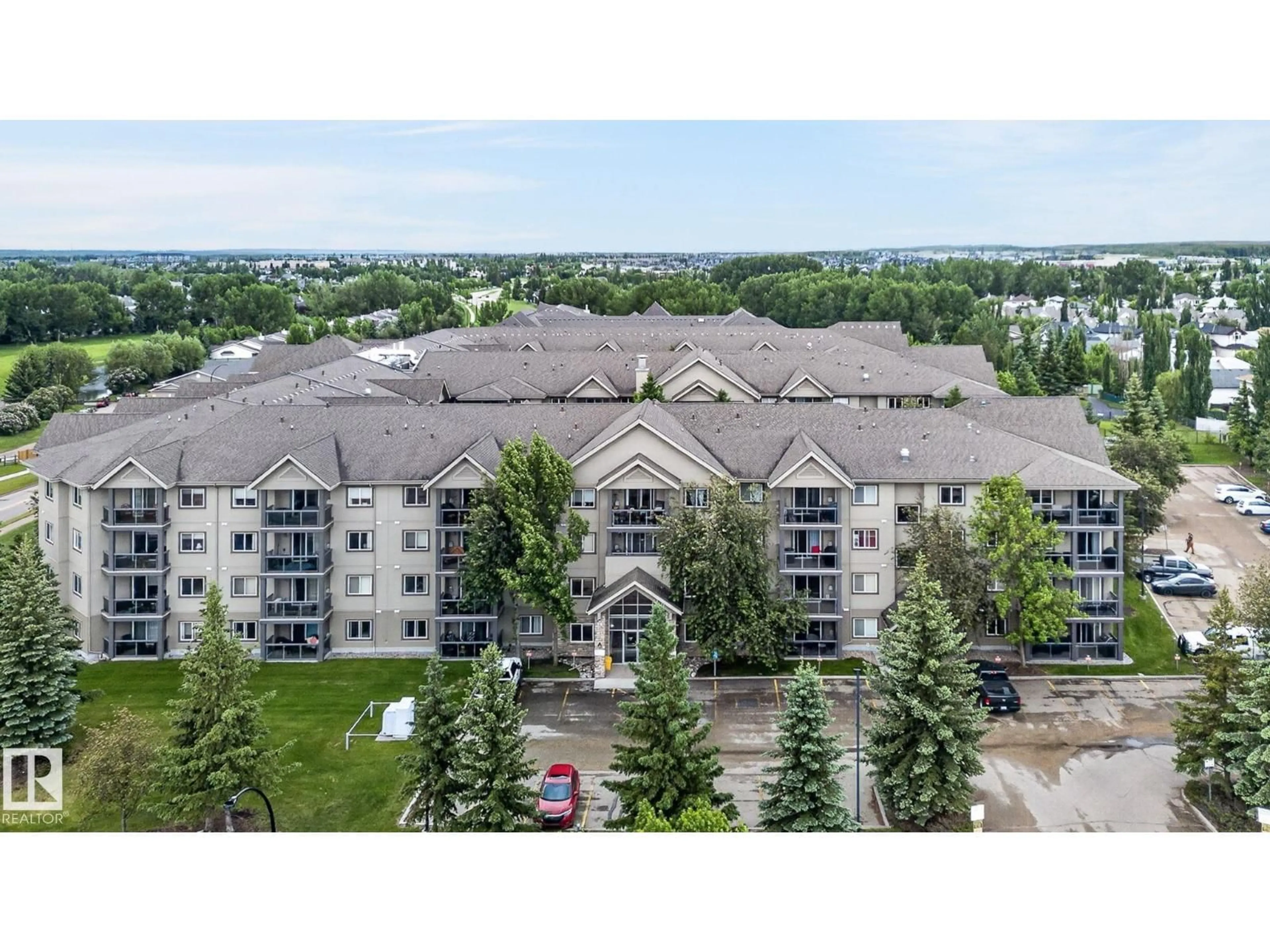 A pic from outside/outdoor area/front of a property/back of a property/a pic from drone, mountain view for 122 279 SUDER GREENS DR, Edmonton Alberta T5T6X6
