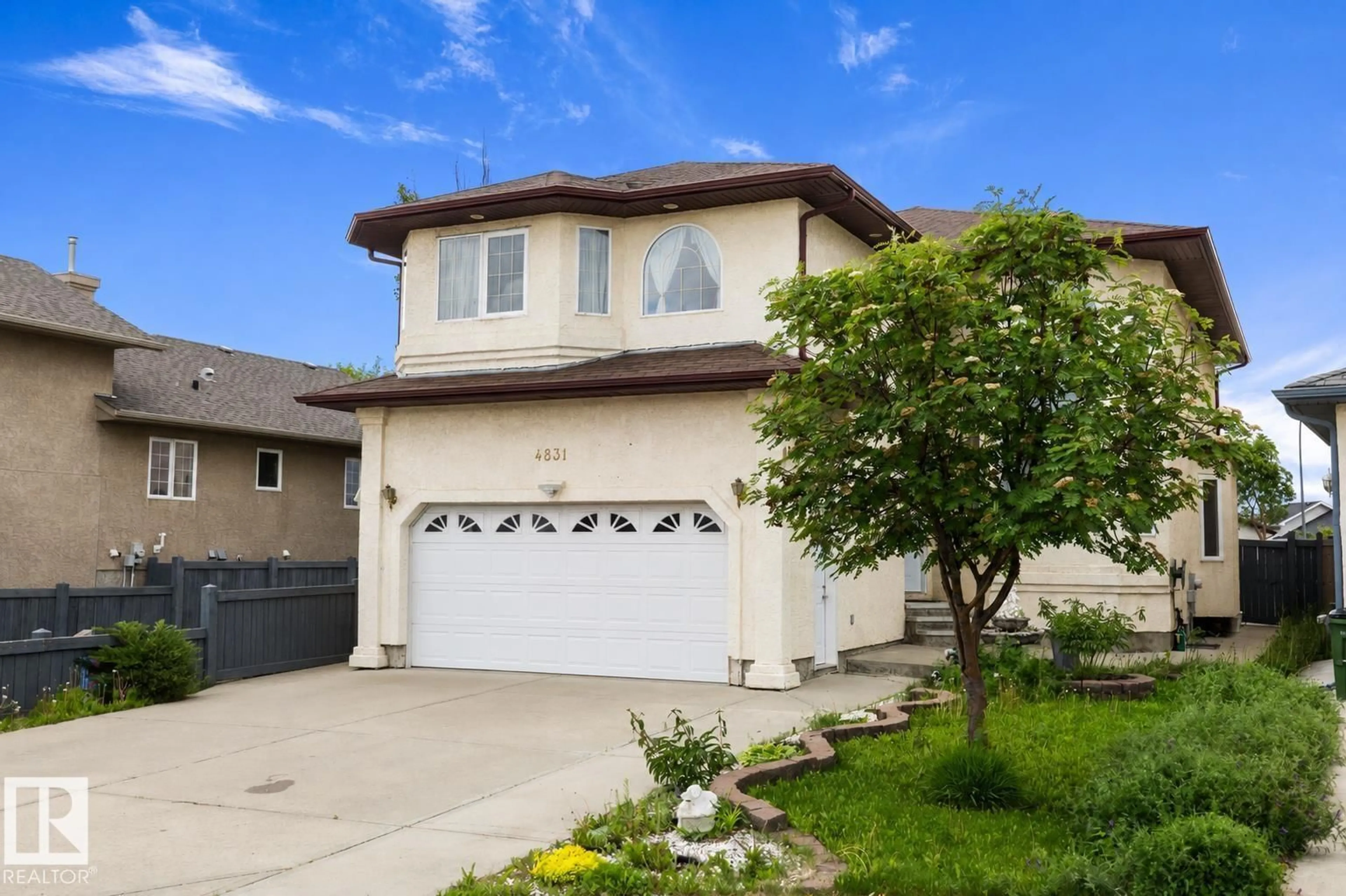 Home with vinyl exterior material, street for 4831 154 AV, Edmonton Alberta T5Y0C1