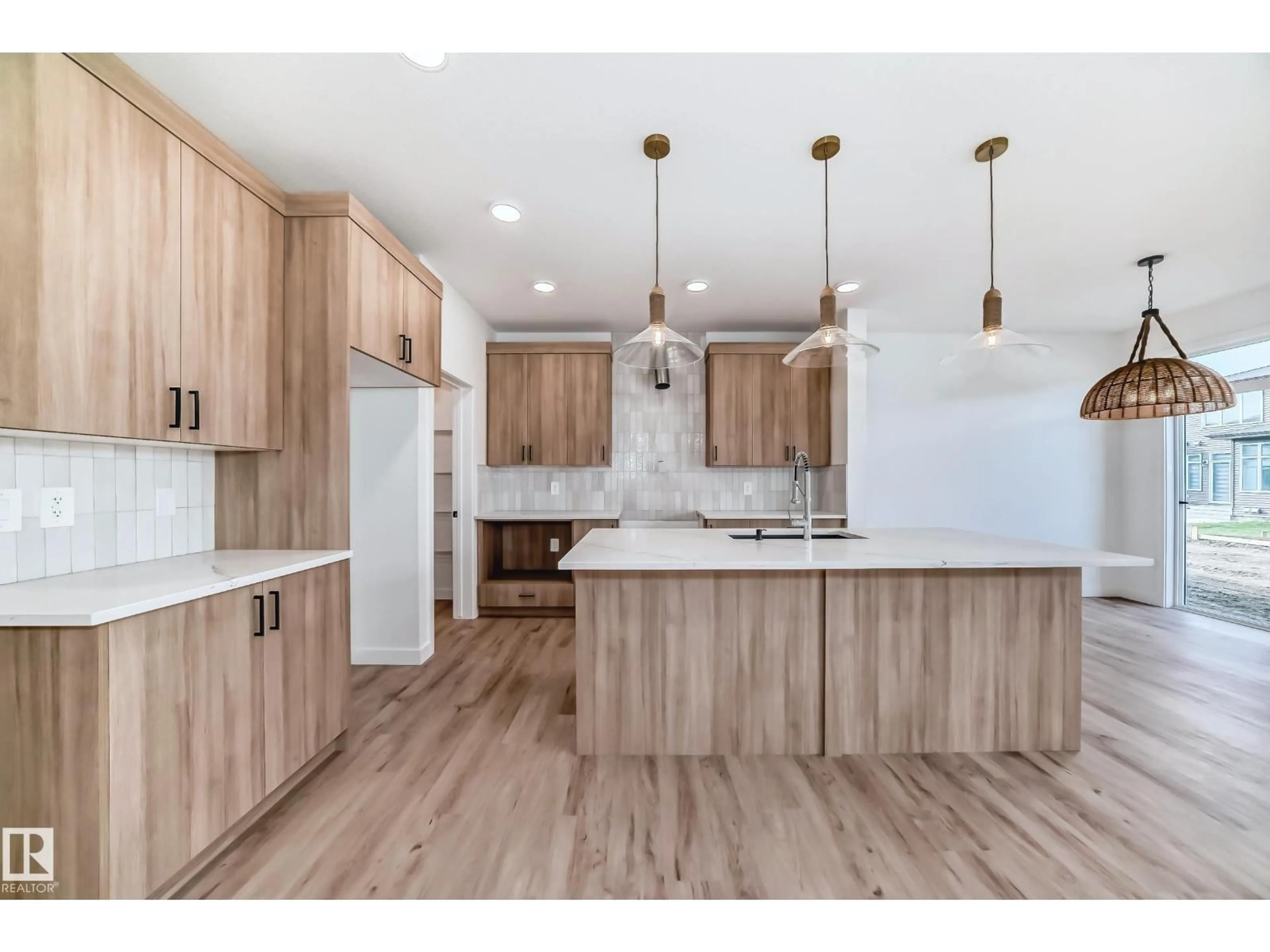Open concept kitchen, wood/laminate floor for SW - 8255 KIRIAK LO, Edmonton Alberta T6W5S2