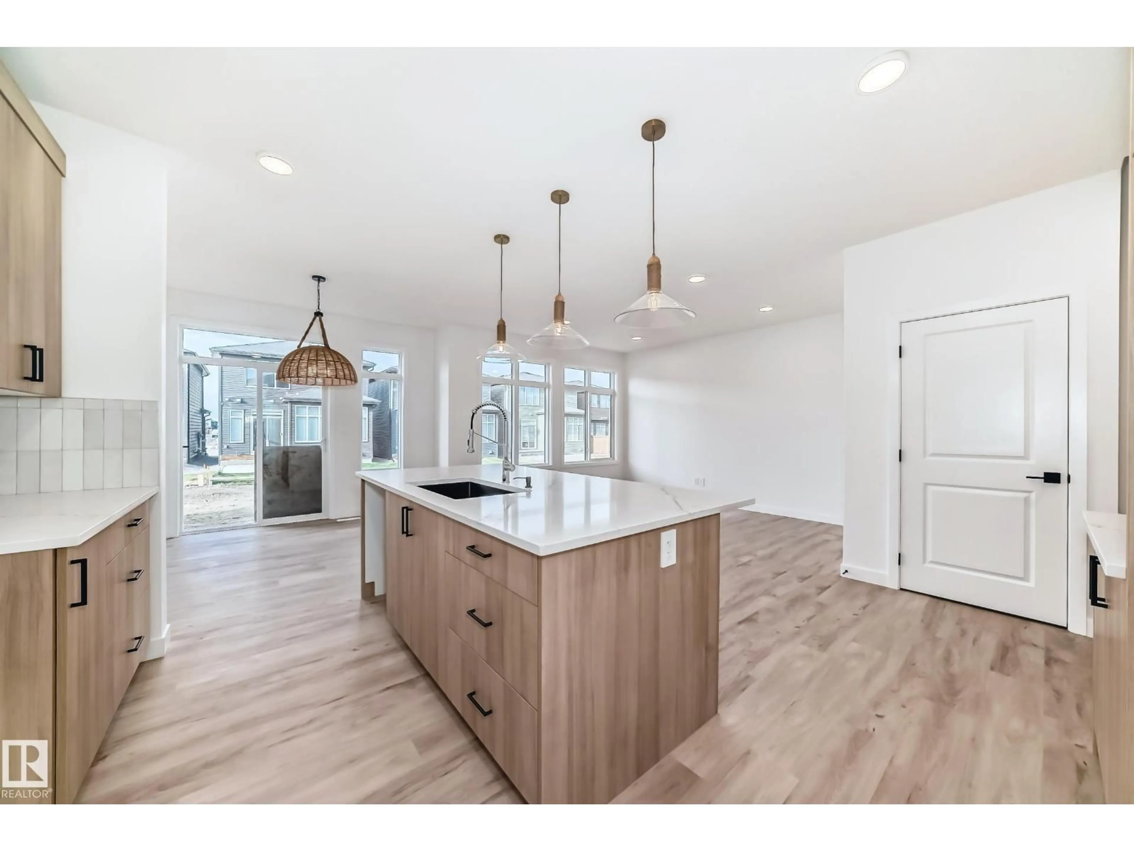 Open concept kitchen, wood/laminate floor for SW - 8255 KIRIAK LO, Edmonton Alberta T6W5S2
