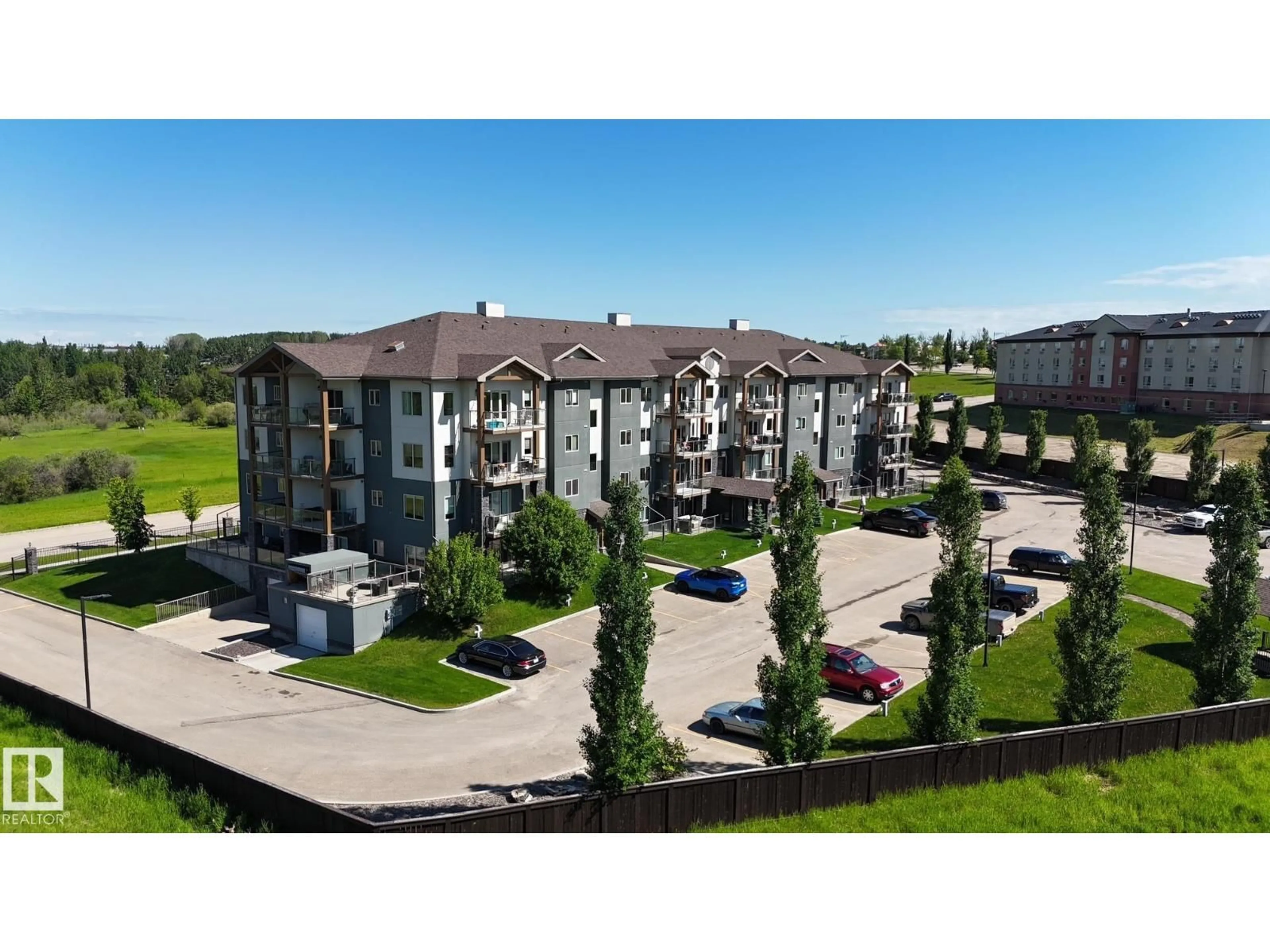 A pic from outside/outdoor area/front of a property/back of a property/a pic from drone, building for #204 - 5201 BROUGHAM DR, Drayton Valley Alberta T7A0C8