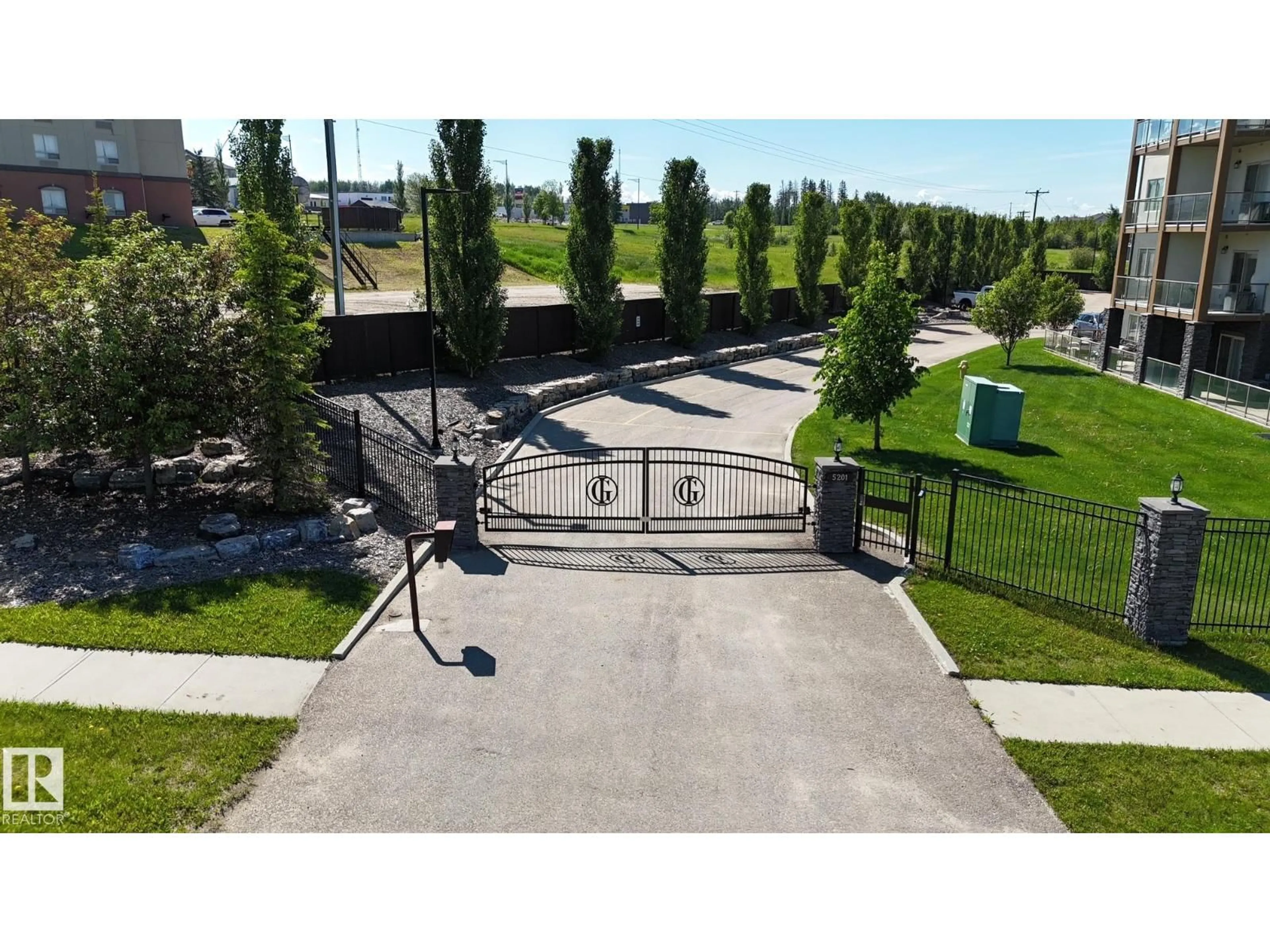 A pic from outside/outdoor area/front of a property/back of a property/a pic from drone, street for #204 - 5201 BROUGHAM DR, Drayton Valley Alberta T7A0C8