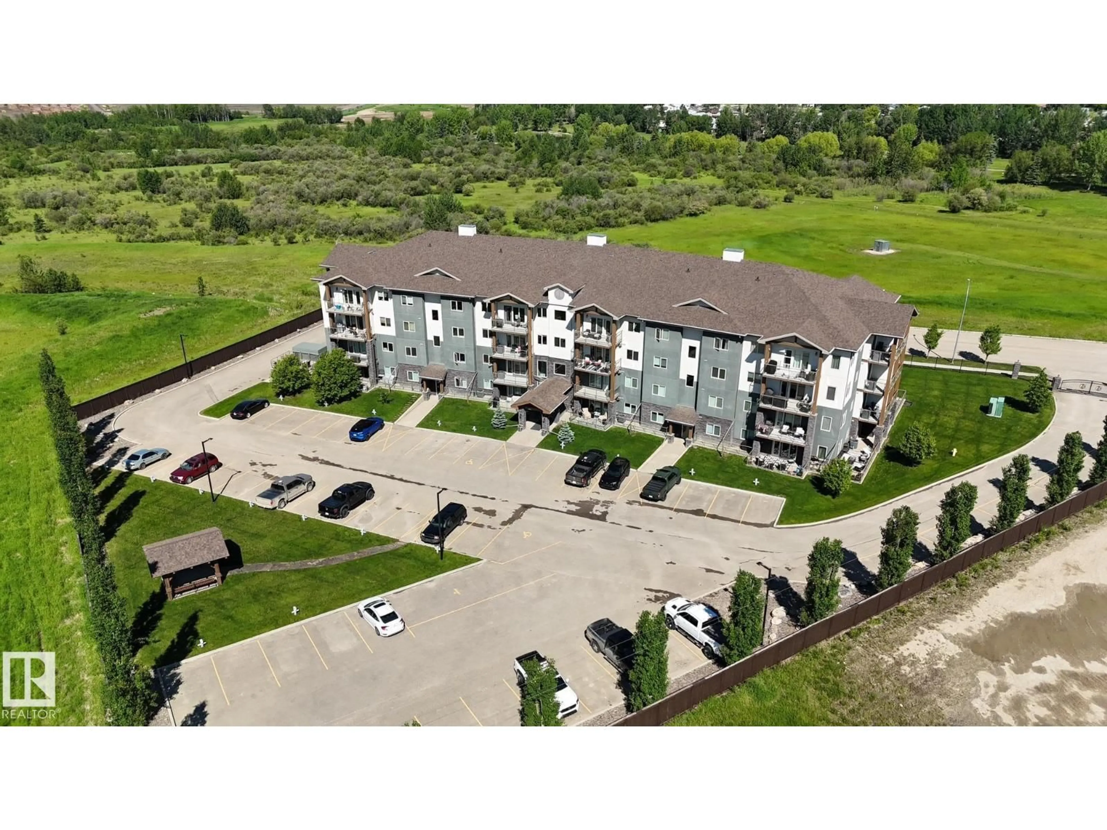A pic from outside/outdoor area/front of a property/back of a property/a pic from drone, building for #204 - 5201 BROUGHAM DR, Drayton Valley Alberta T7A0C8