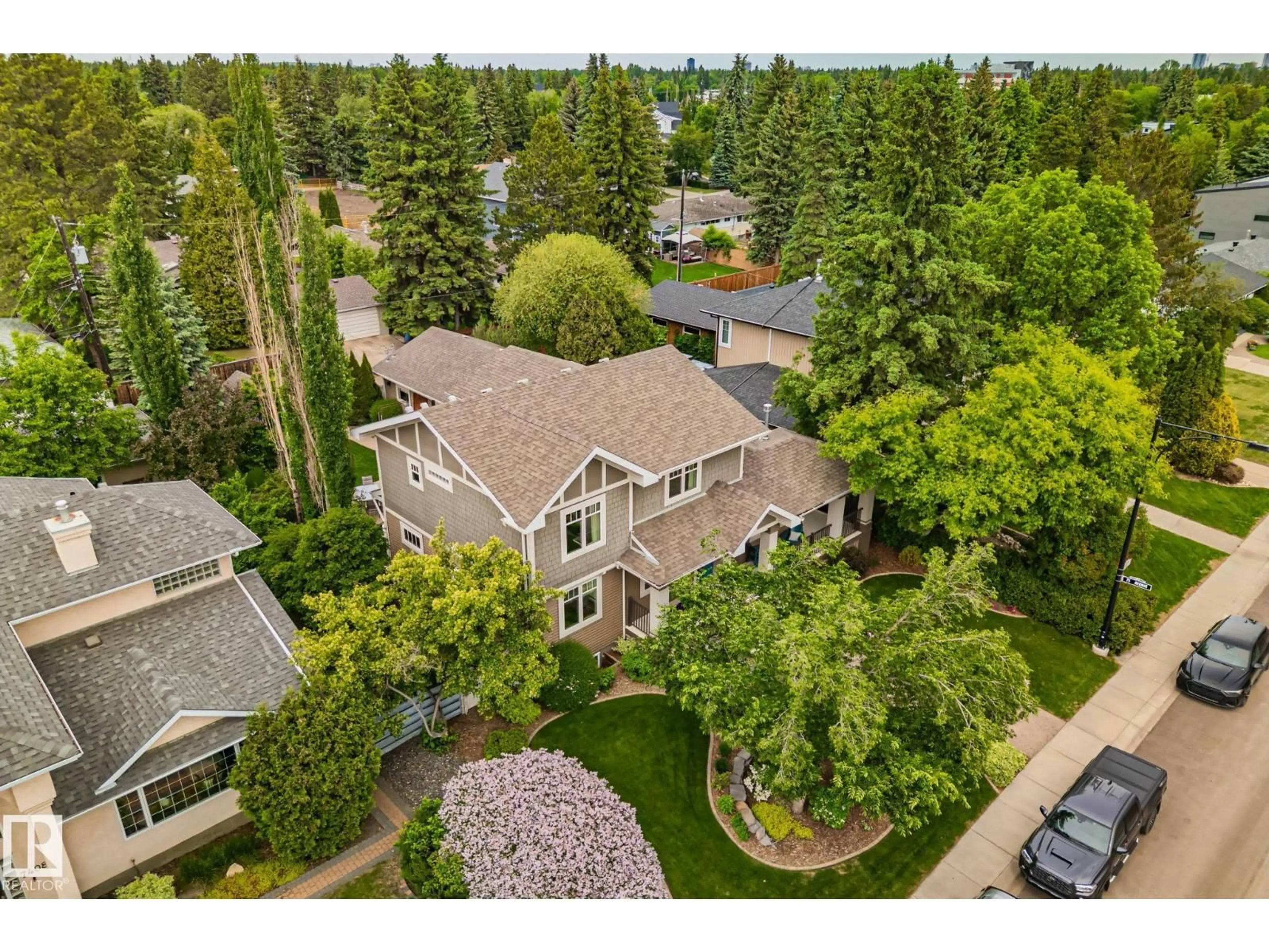 A pic from outside/outdoor area/front of a property/back of a property/a pic from drone, street for 7504 142A ST NW, Edmonton Alberta T5R0N4