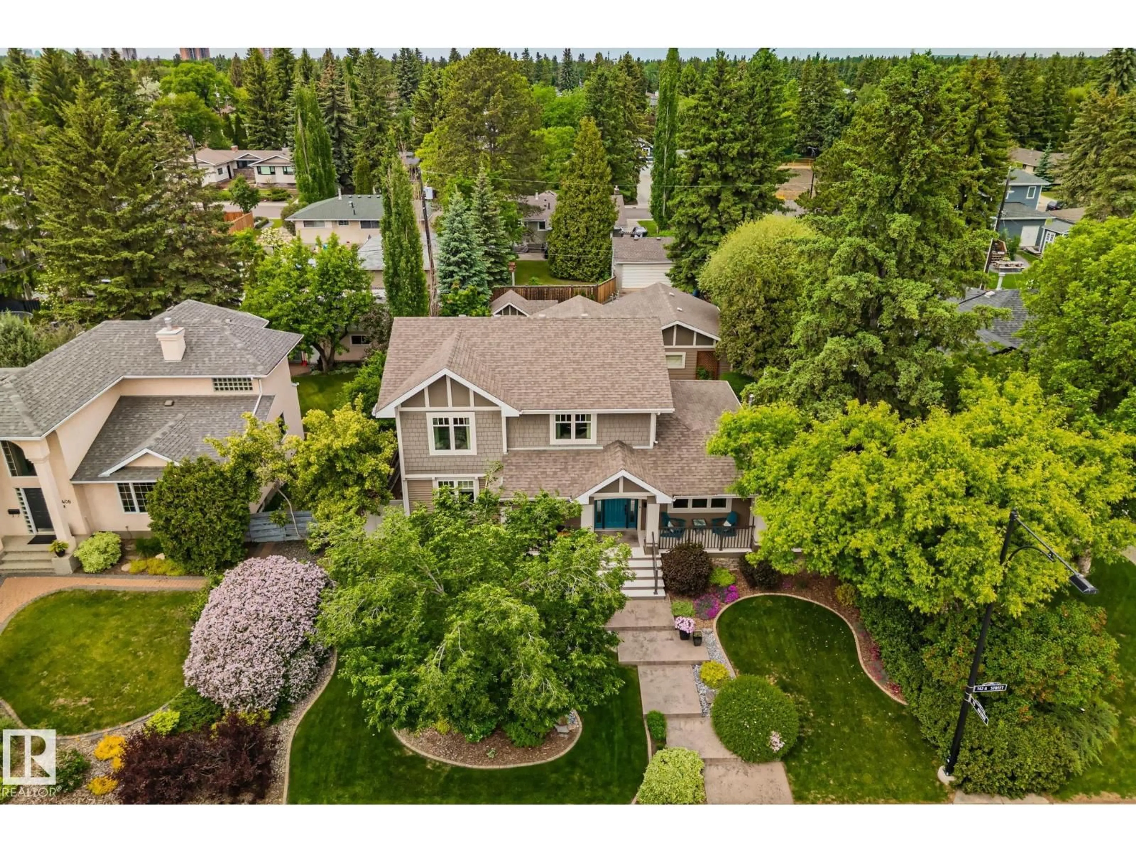A pic from outside/outdoor area/front of a property/back of a property/a pic from drone, street for 7504 142A ST NW, Edmonton Alberta T5R0N4