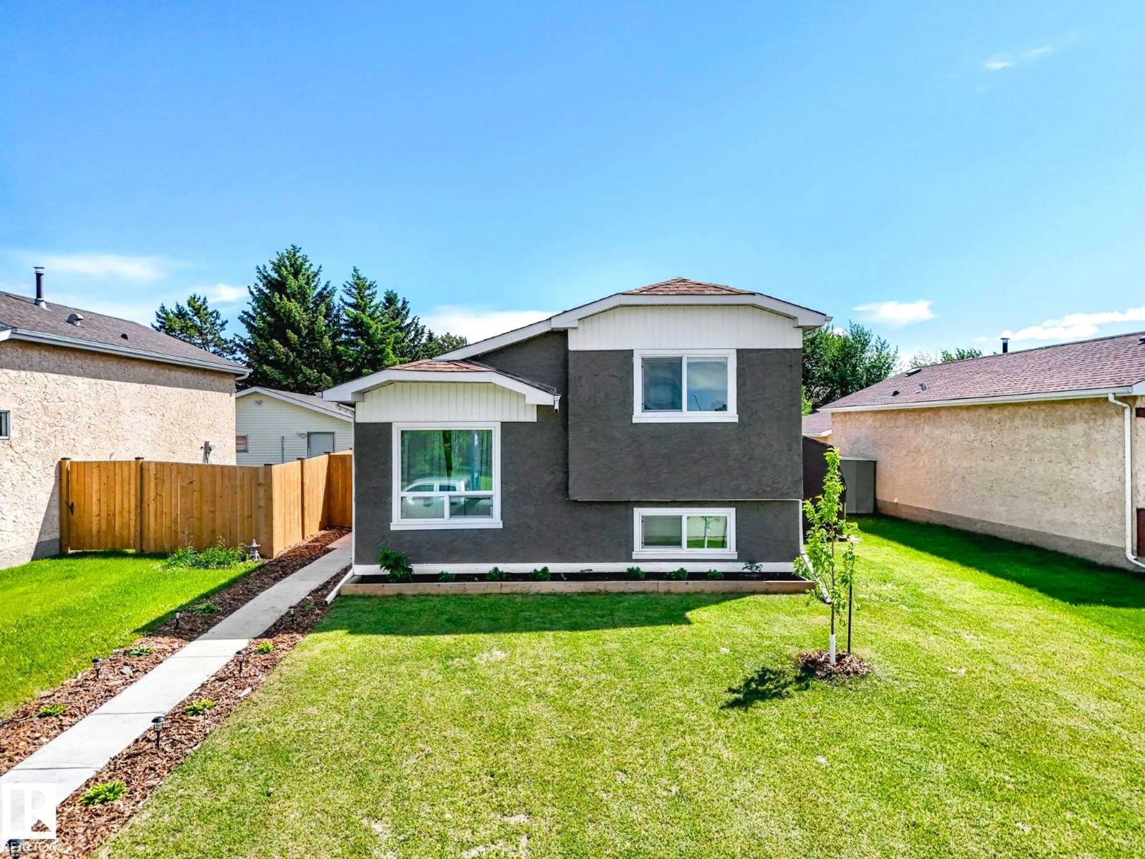Home with vinyl exterior material, street for NW - 4115 41 AV, Edmonton Alberta T6L5M3
