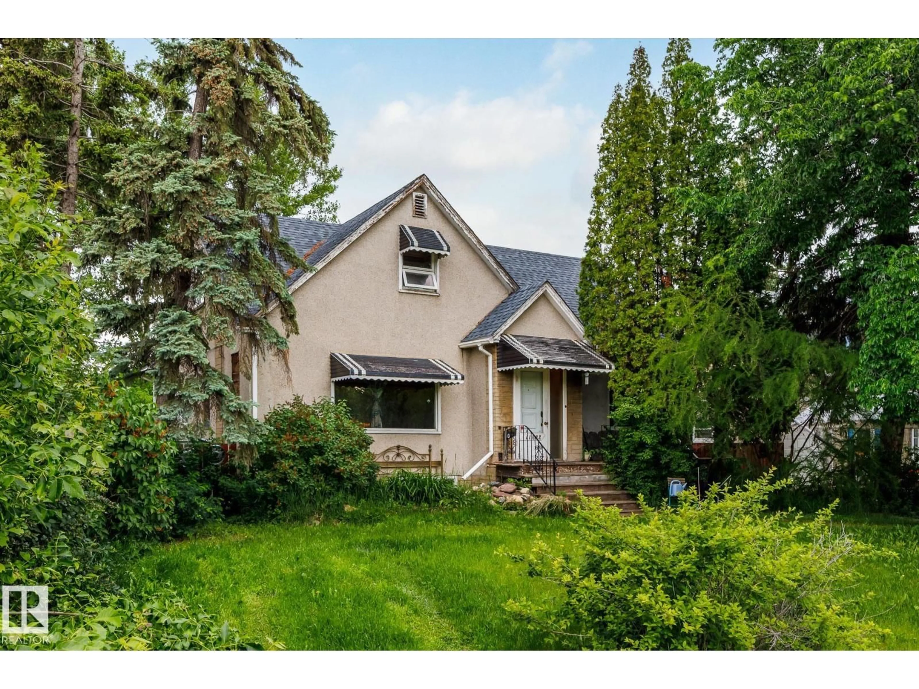 Home with vinyl exterior material, street for 11022 110 AV, Edmonton Alberta T5H1H9