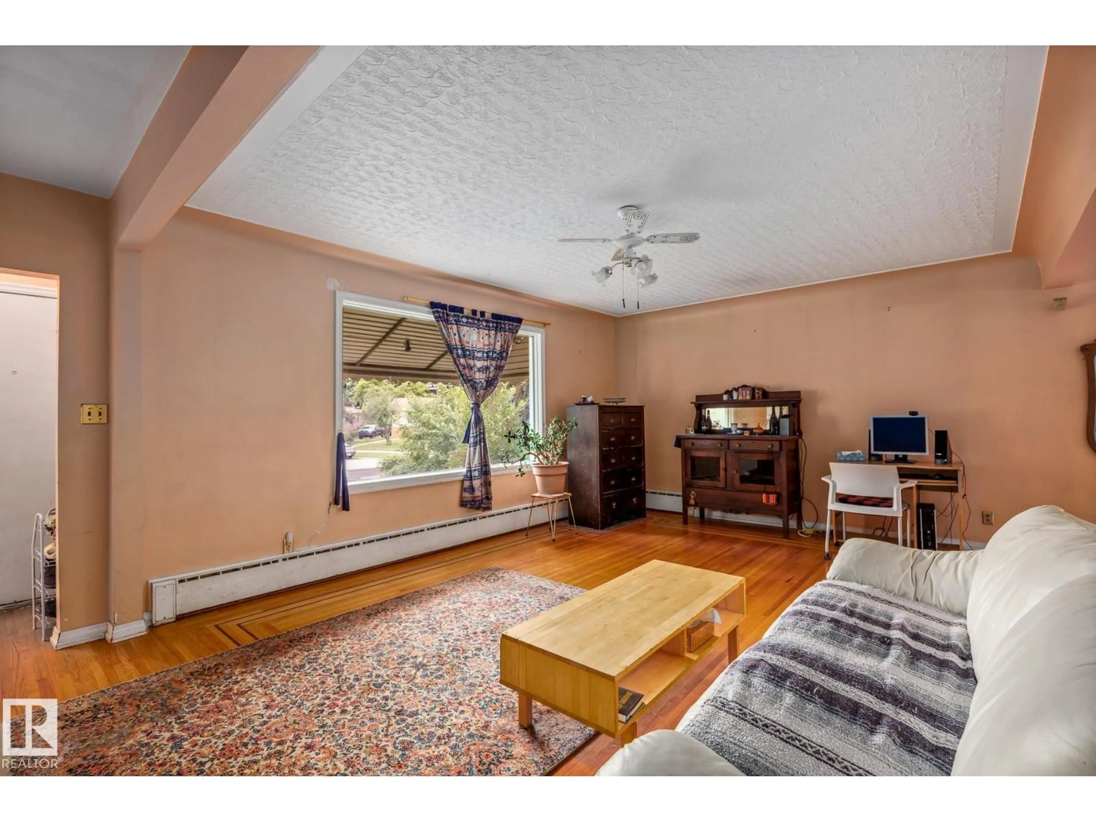 Living room with furniture, unknown for 11022 110 AV, Edmonton Alberta T5H1H9