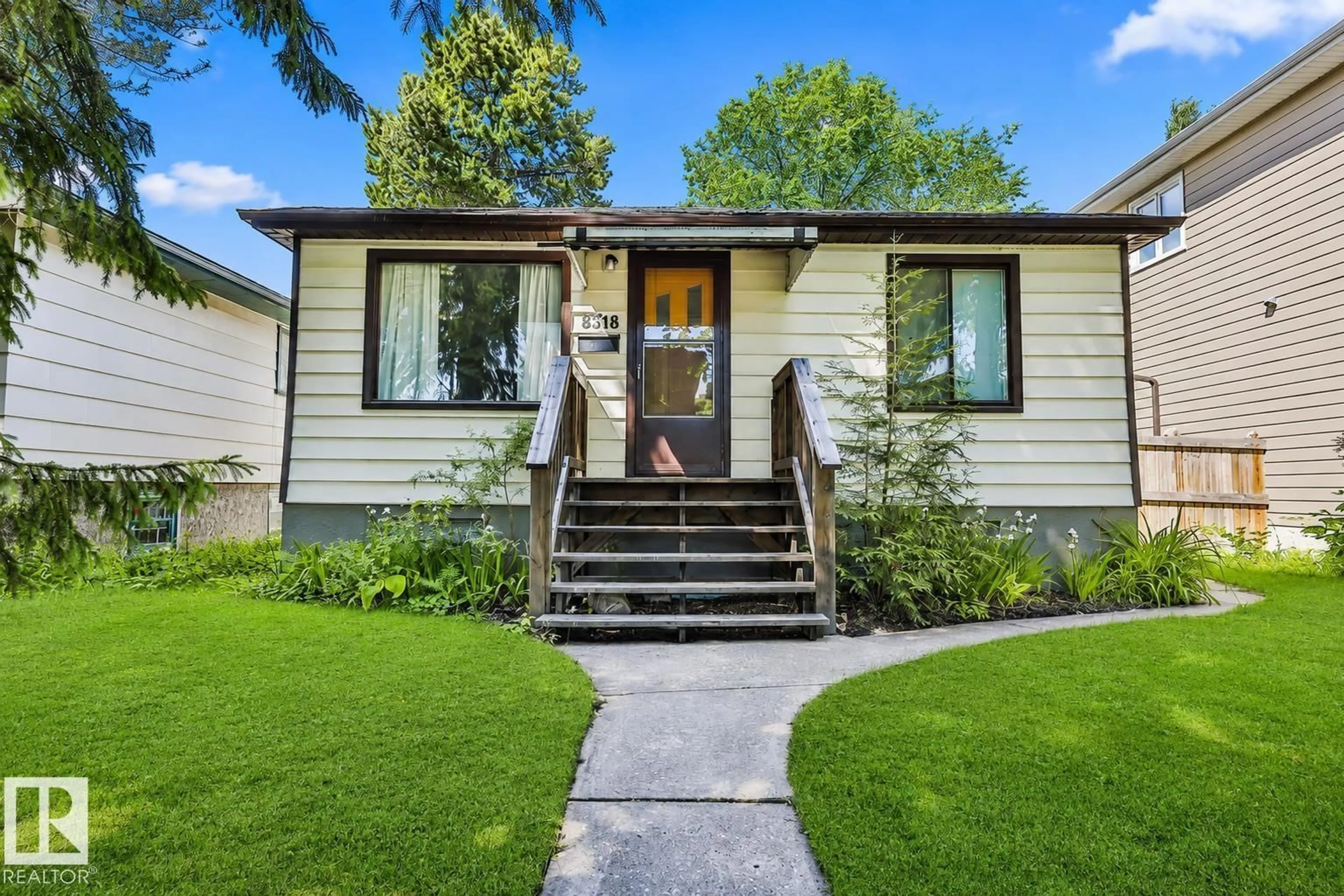 Home with vinyl exterior material, street for 8318 80 AV, Edmonton Alberta T6C0T1