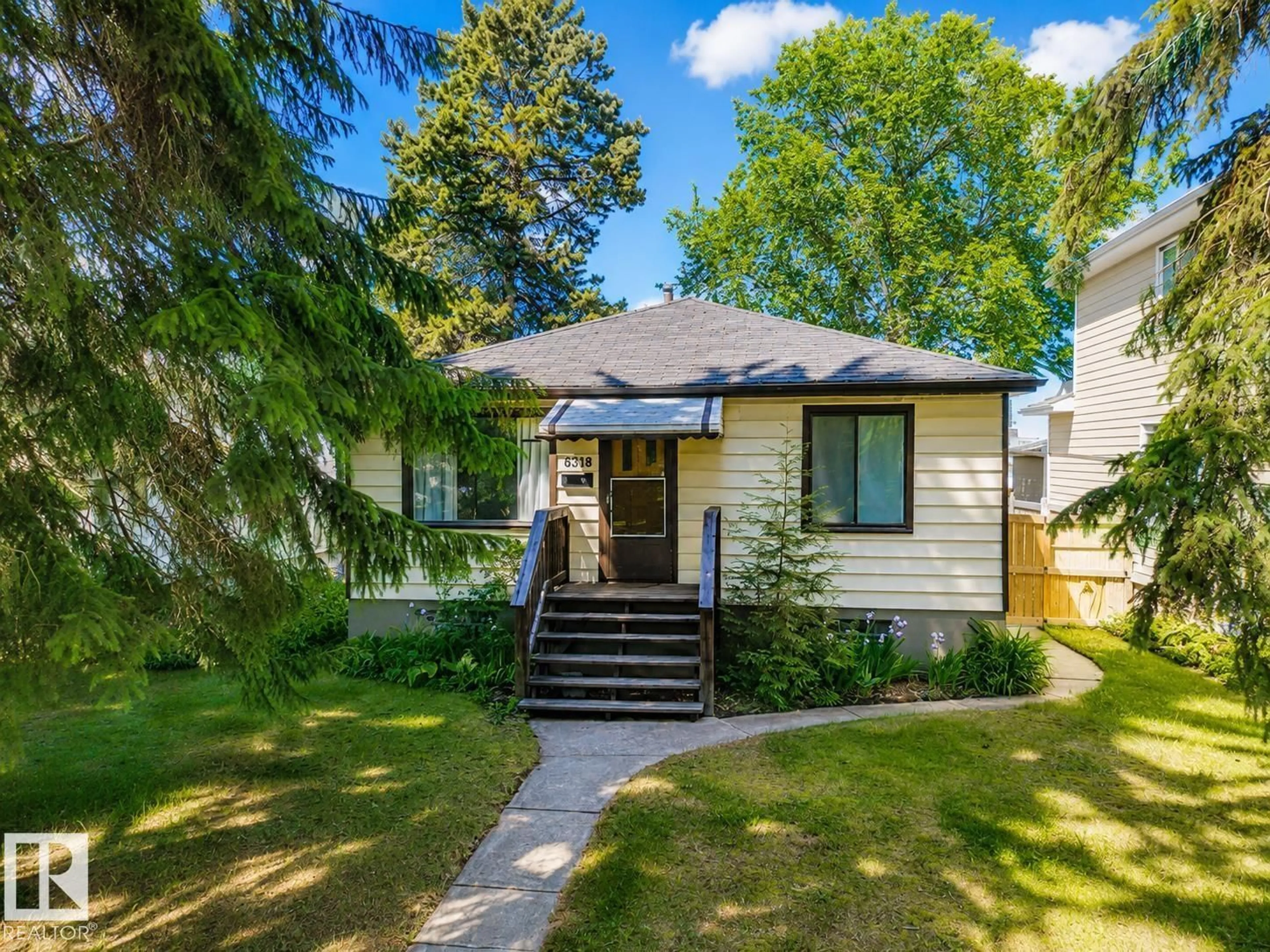 Home with vinyl exterior material, street for 8318 80 AV, Edmonton Alberta T6C0T1