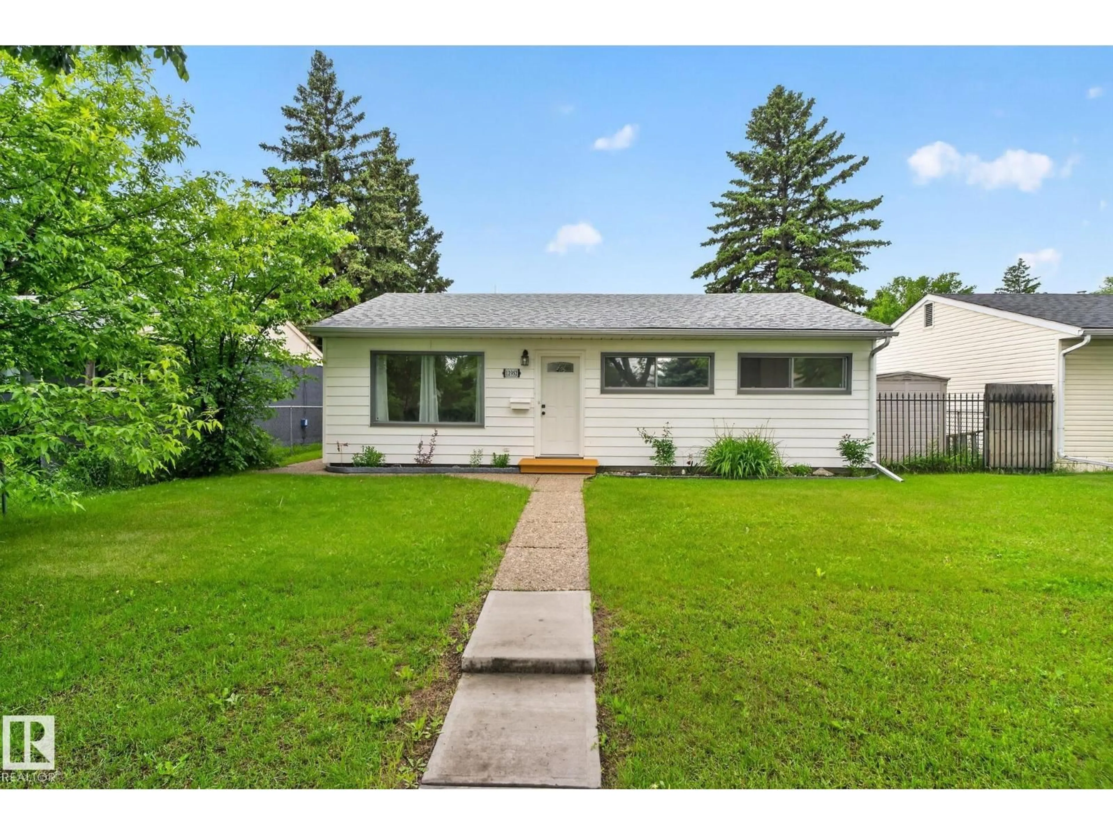 Home with vinyl exterior material, street for NW - 12952 114 ST, Edmonton Alberta T5E5C8