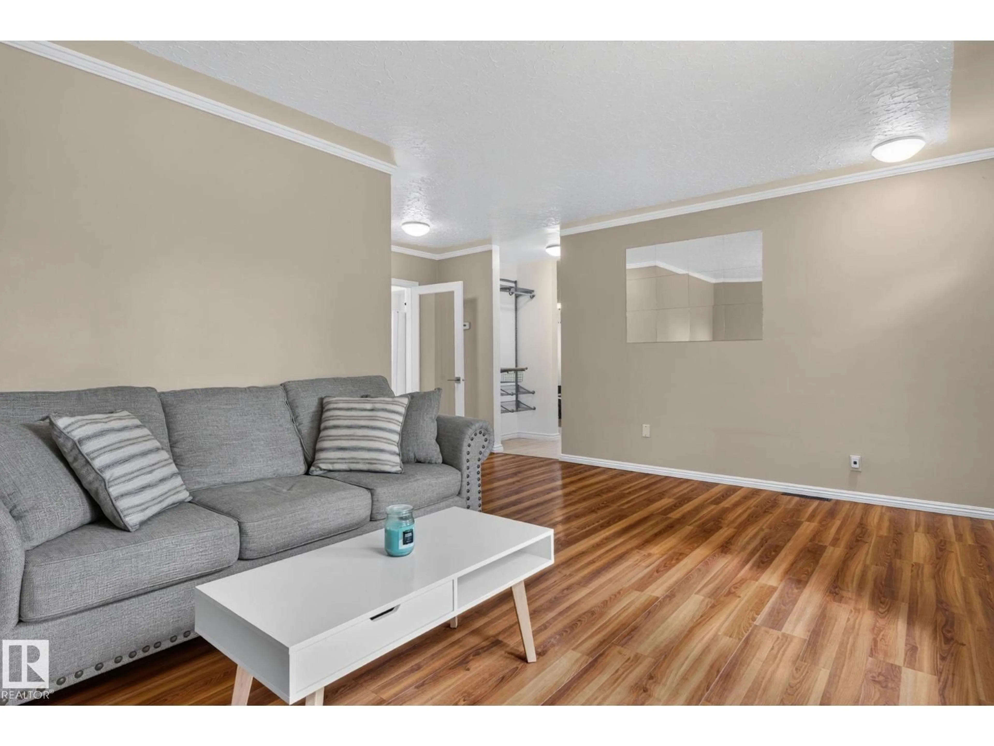 Living room with furniture, wood/laminate floor for NW - 12952 114 ST, Edmonton Alberta T5E5C8
