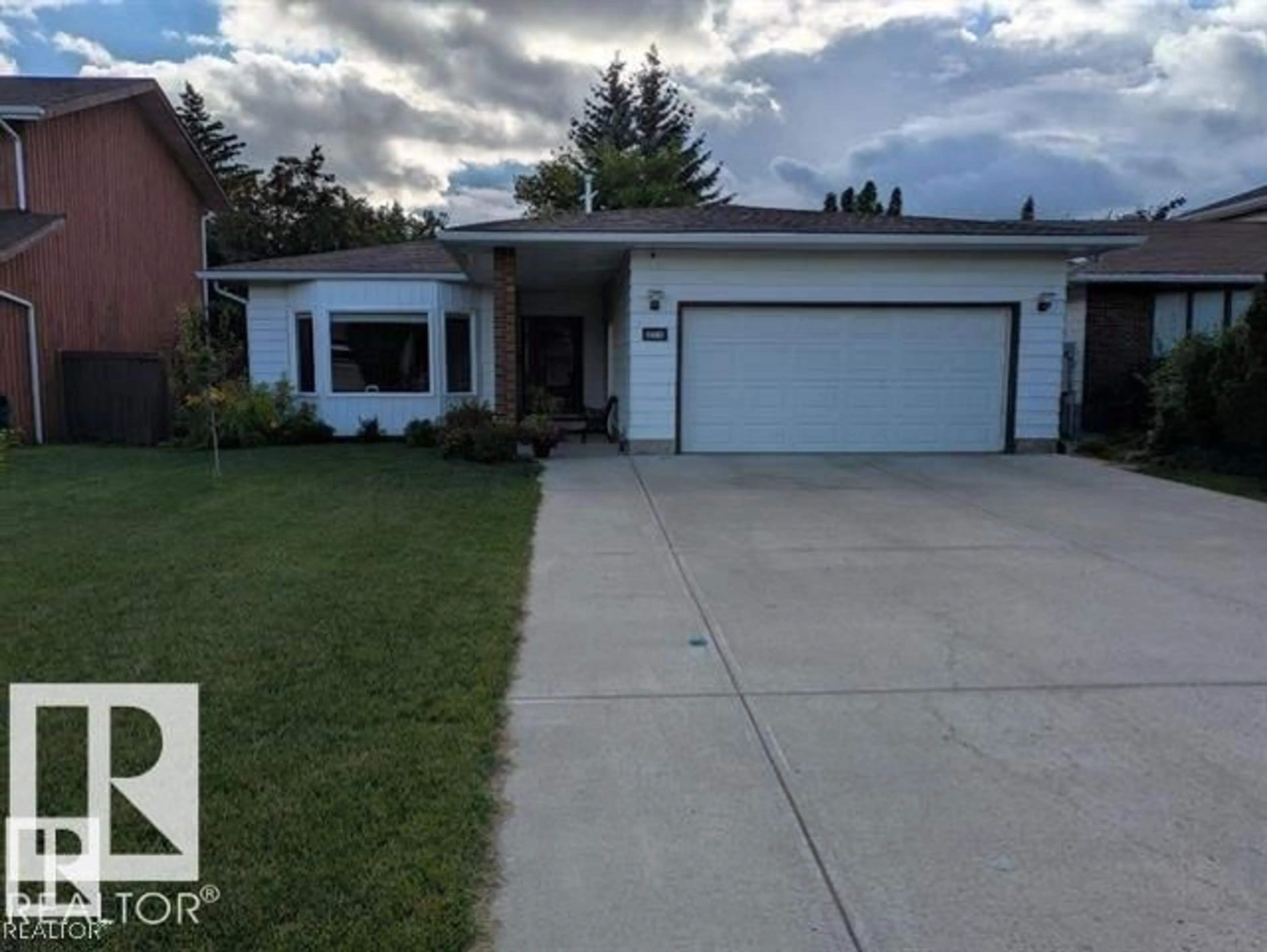 Home with vinyl exterior material, street for NW - 3718 103B ST, Edmonton Alberta T6J2X9