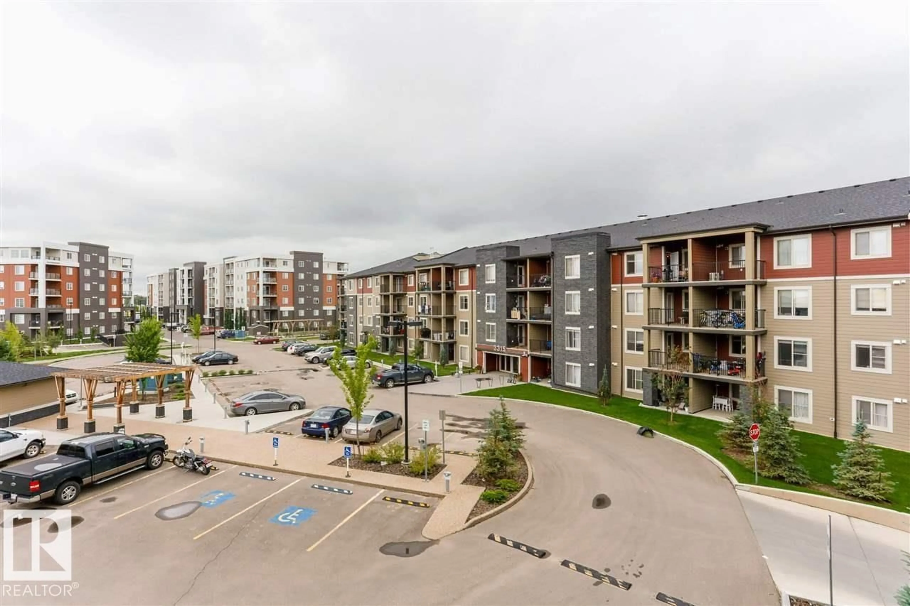 A pic from outside/outdoor area/front of a property/back of a property/a pic from drone, city buildings view from balcony for #328 - 3315 JAMES MOWATT TR, Edmonton Alberta T6W3L9