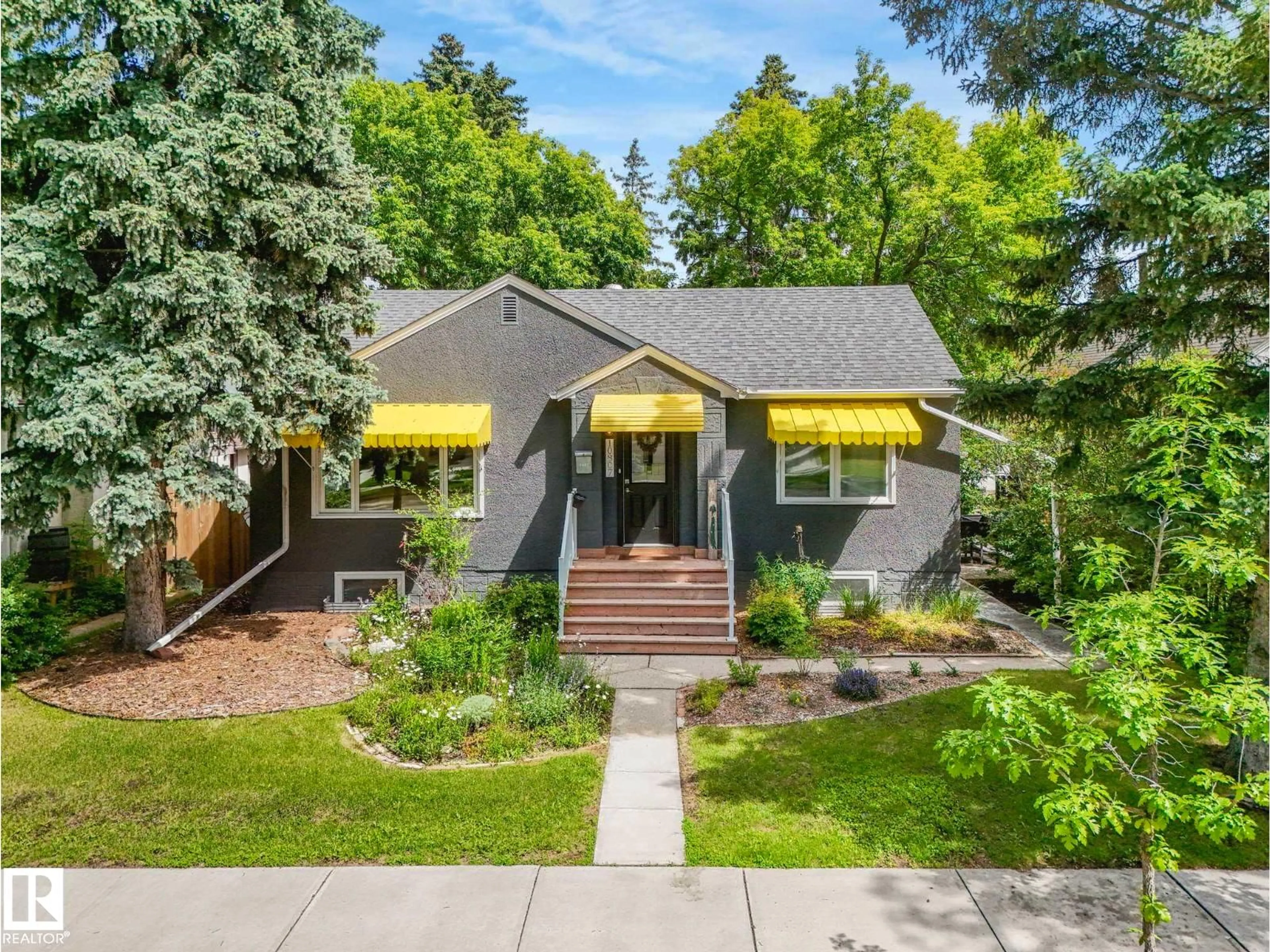Home with brick exterior material, street for NW - 10807 135 ST, Edmonton Alberta T5M1J8