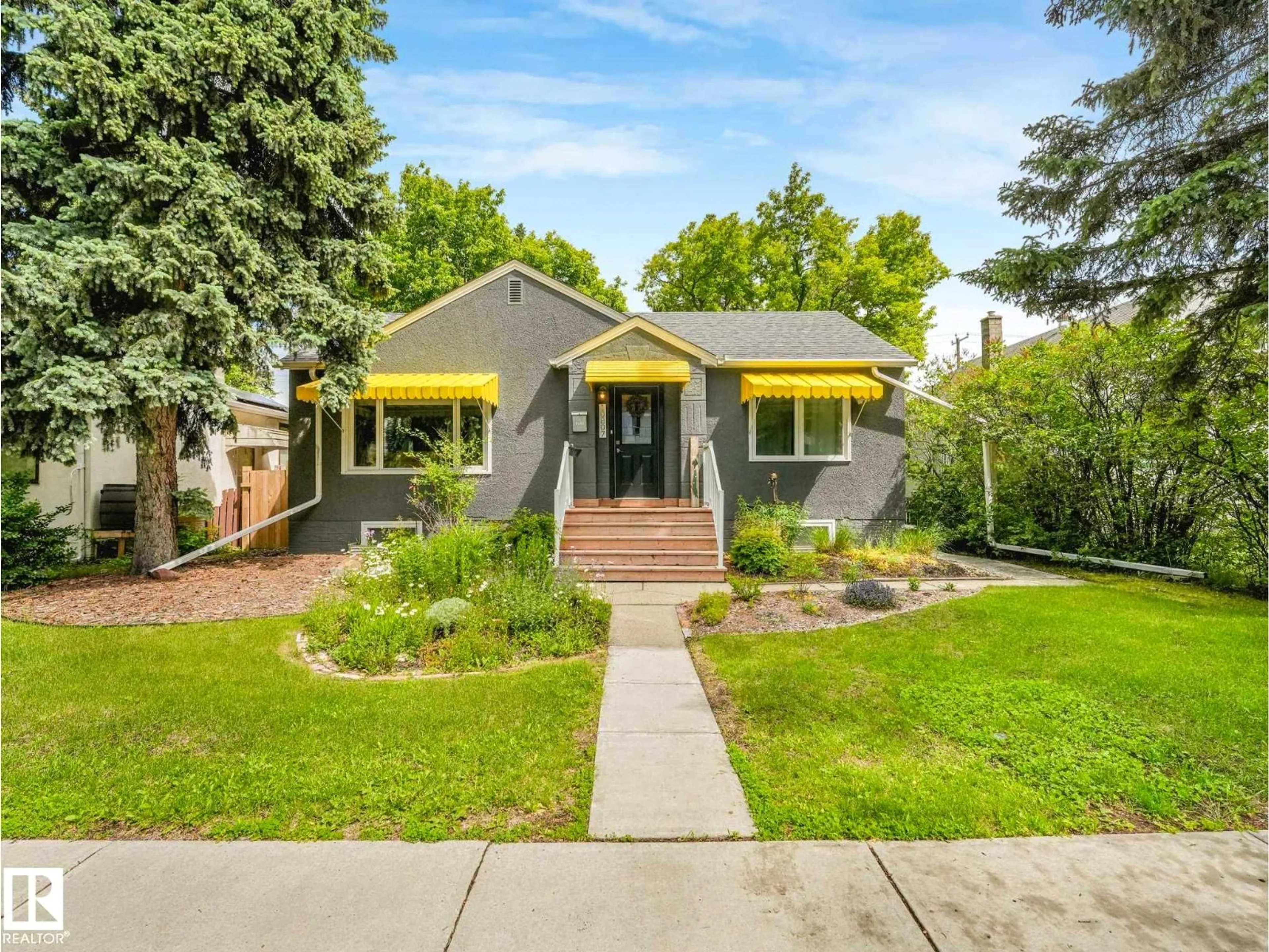 Home with brick exterior material, street for NW - 10807 135 ST, Edmonton Alberta T5M1J8