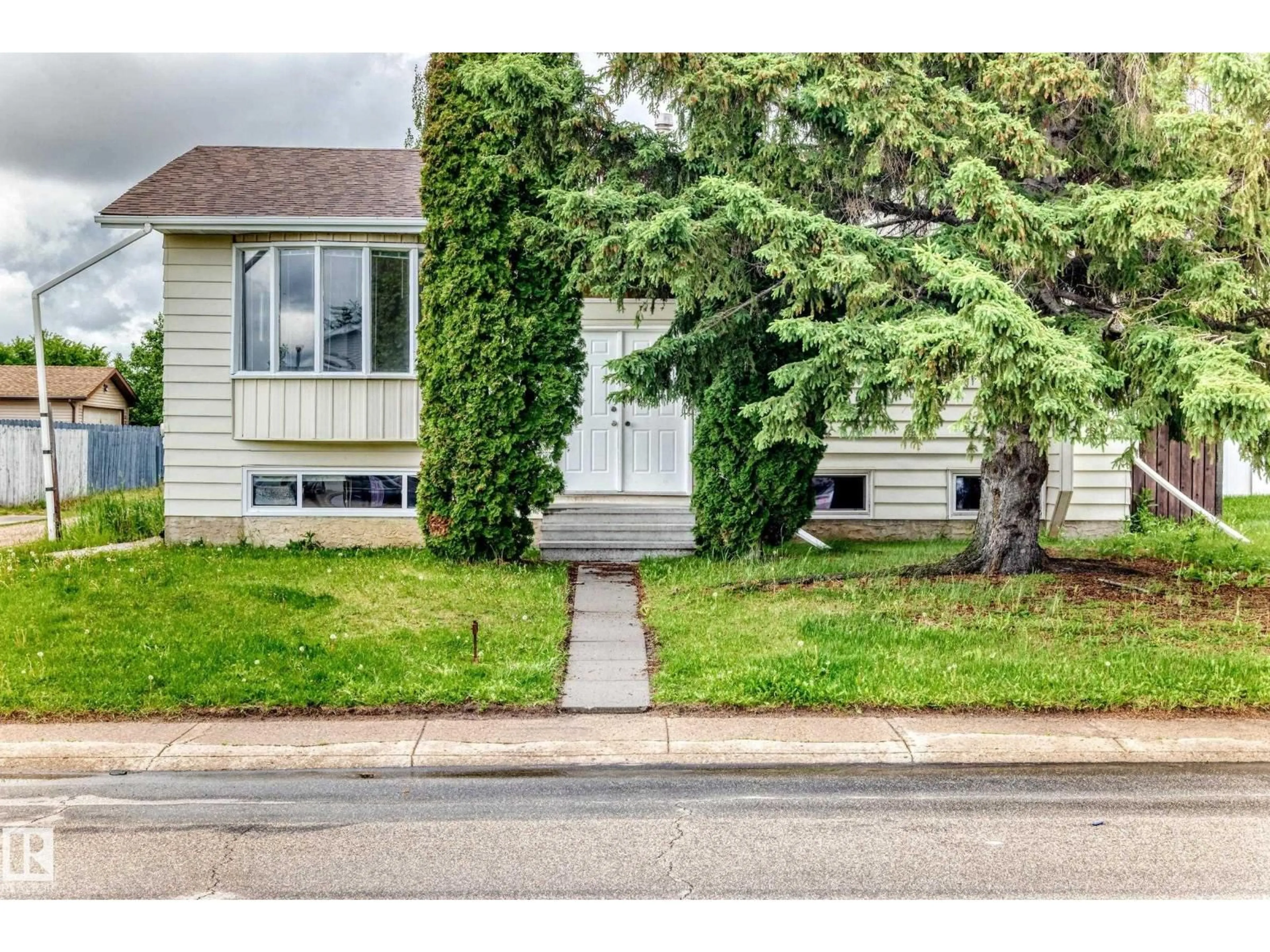Home with vinyl exterior material, street for NW - 1103 56 ST, Edmonton Alberta T6L1Y4