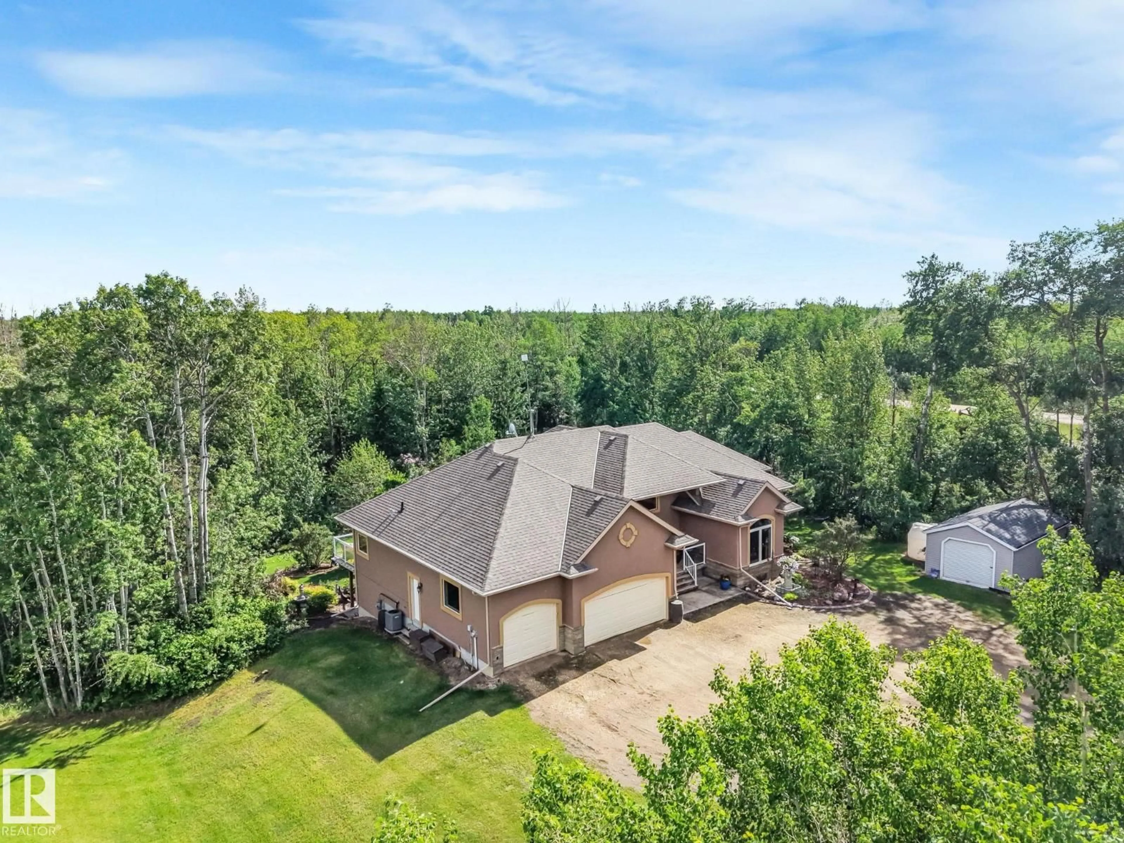 A pic from outside/outdoor area/front of a property/back of a property/a pic from drone, water/lake/river/ocean view for 160 50446 RGE RD 232, Rural Leduc County Alberta T4X0L1