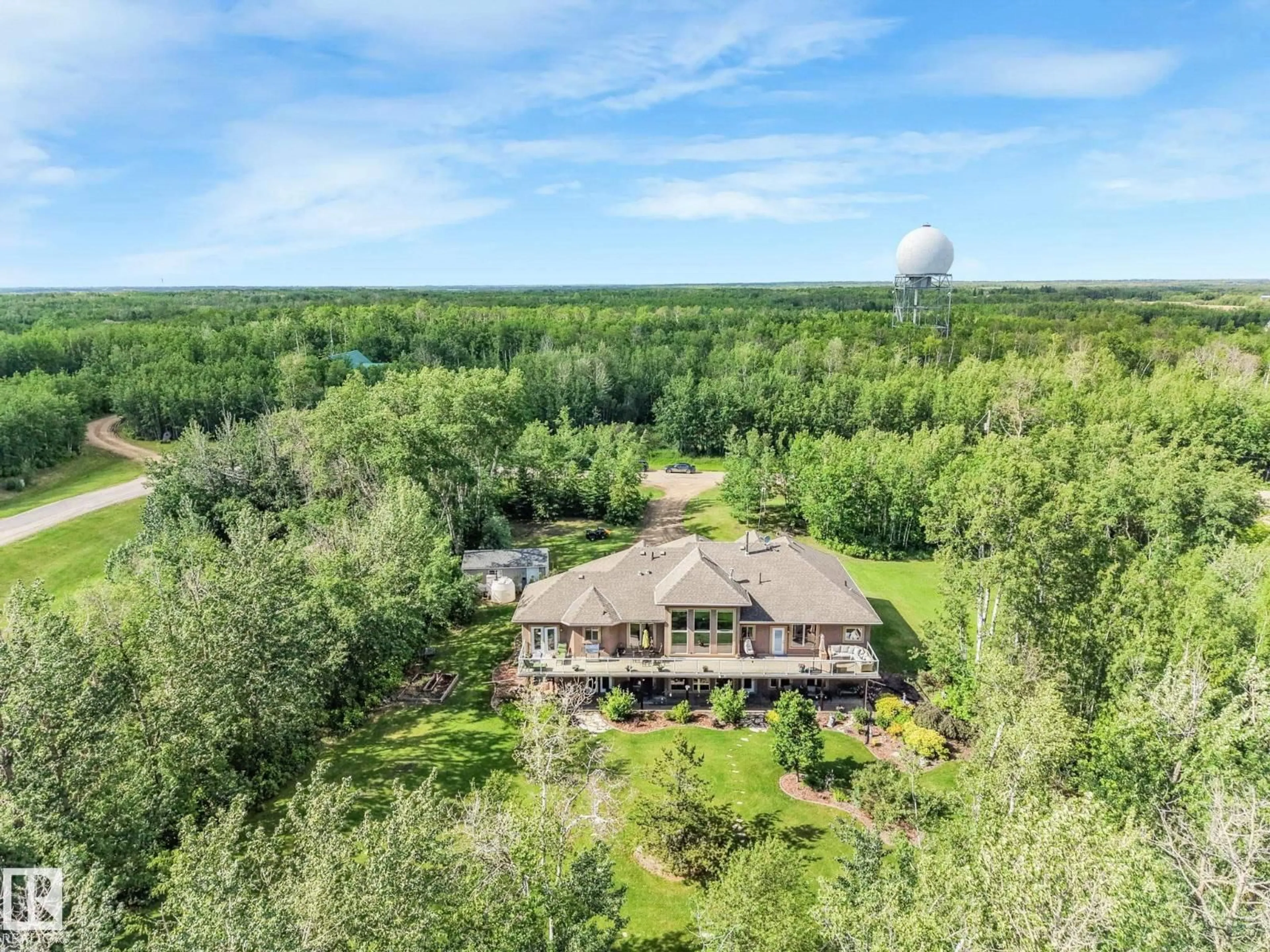 A pic from outside/outdoor area/front of a property/back of a property/a pic from drone, forest/trees view for 160 50446 RGE RD 232, Rural Leduc County Alberta T4X0L1