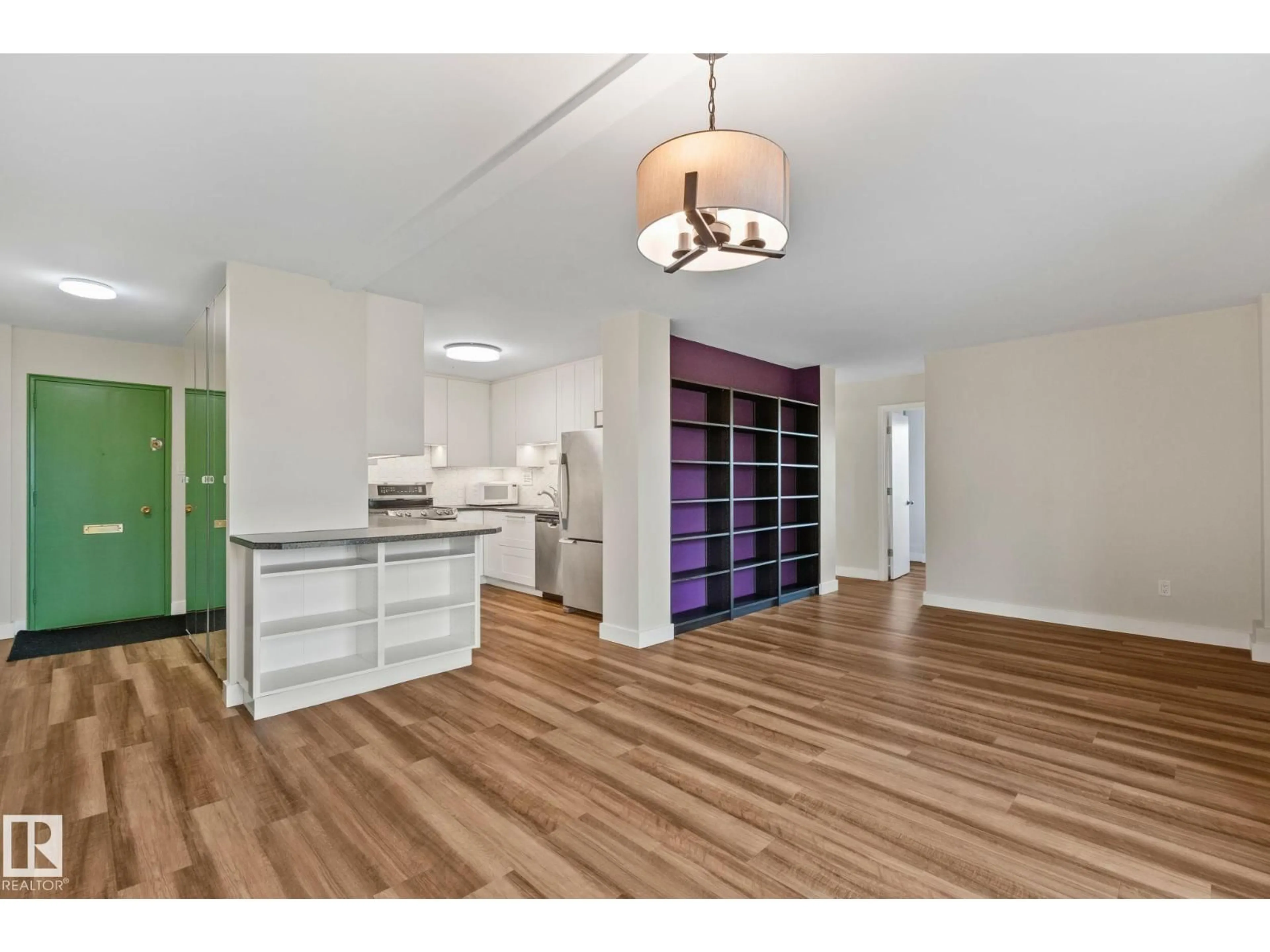 Open concept kitchen, wood/laminate floor for #705 - 9940 112 ST, Edmonton Alberta T5K1L8