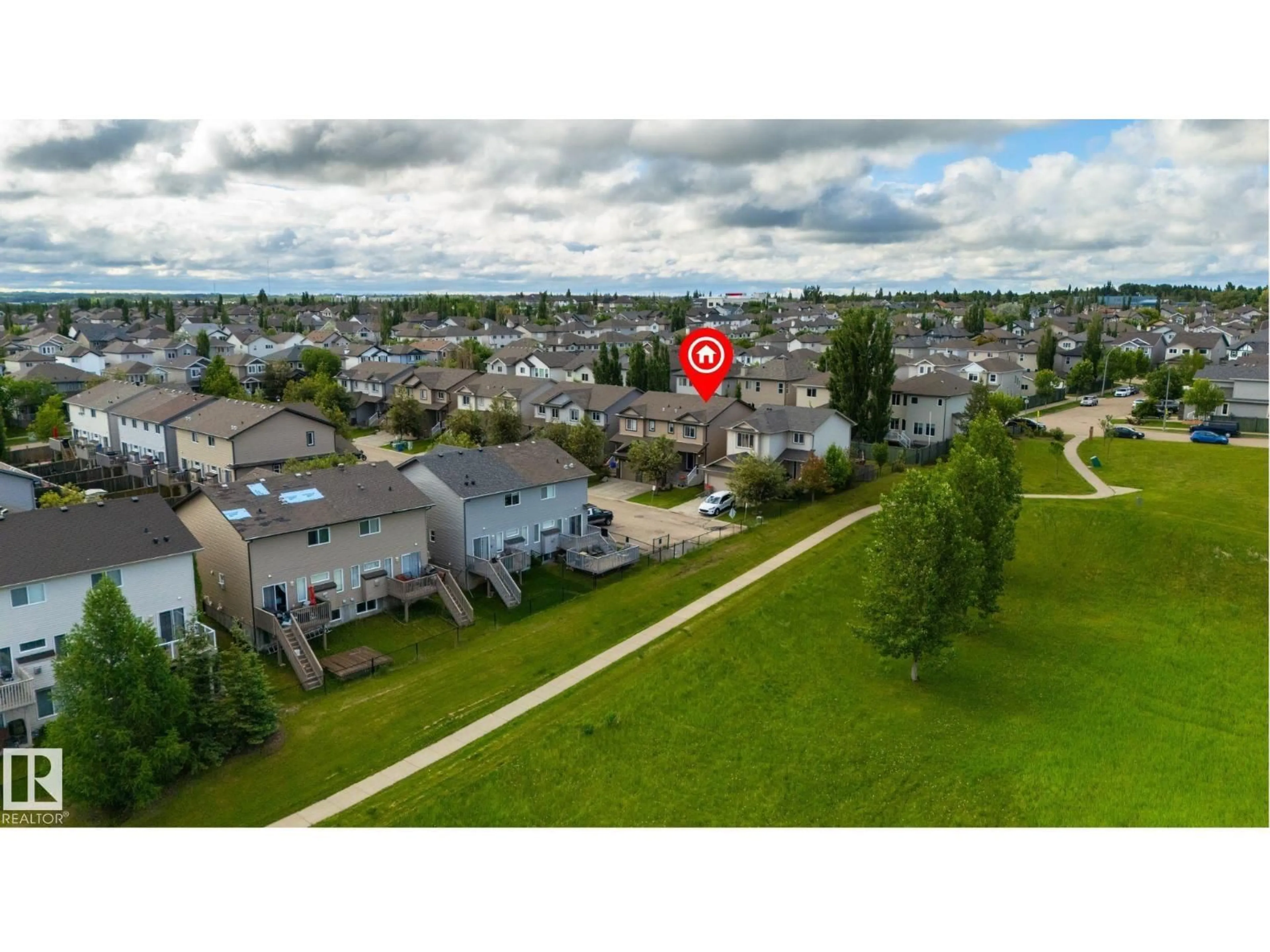 A pic from outside/outdoor area/front of a property/back of a property/a pic from drone, street for 28 85 SPRUCE VILLAGE DR, Spruce Grove Alberta T7X0L2