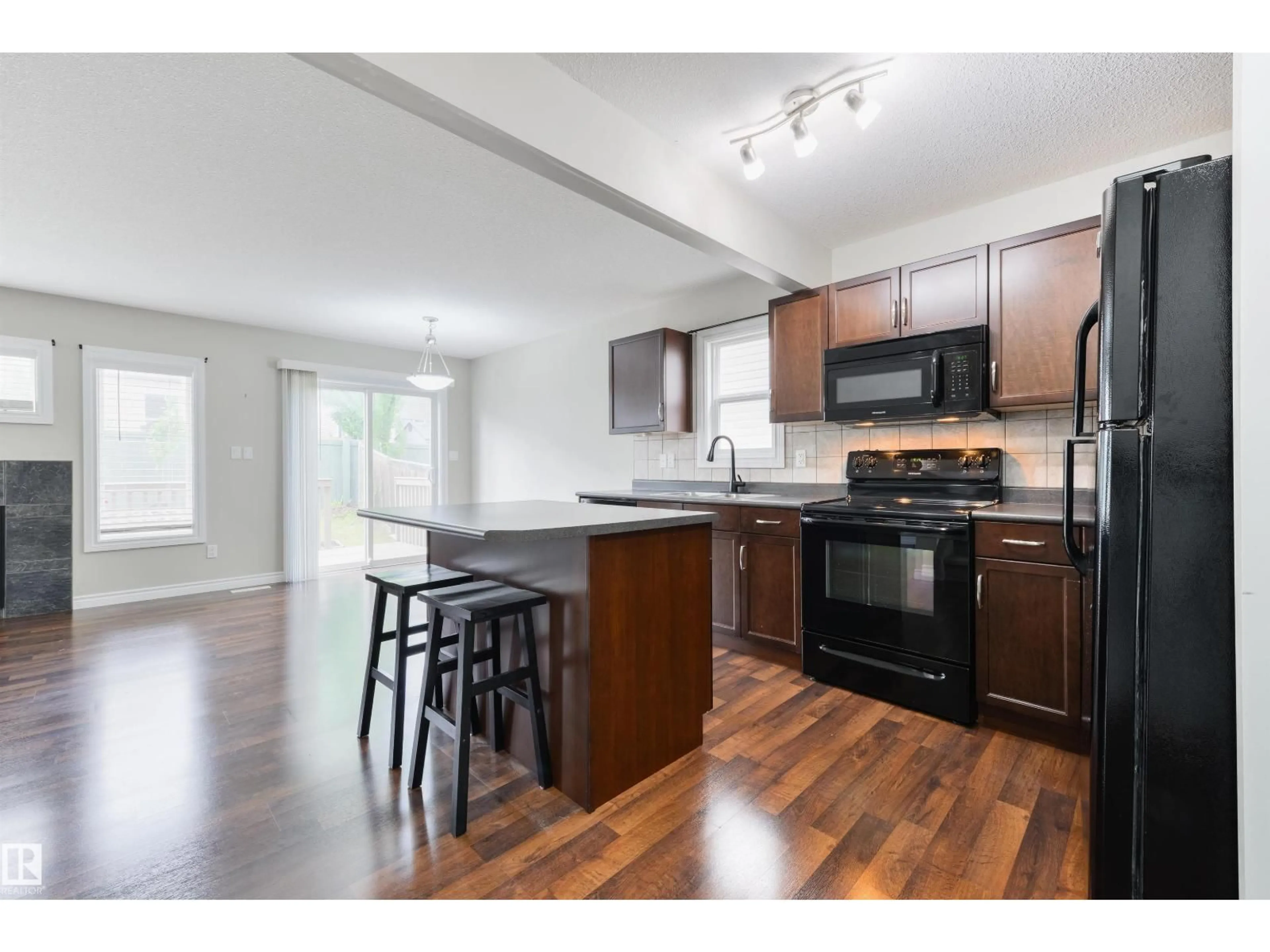 Open concept kitchen, wood/laminate floor for 28 85 SPRUCE VILLAGE DR, Spruce Grove Alberta T7X0L2
