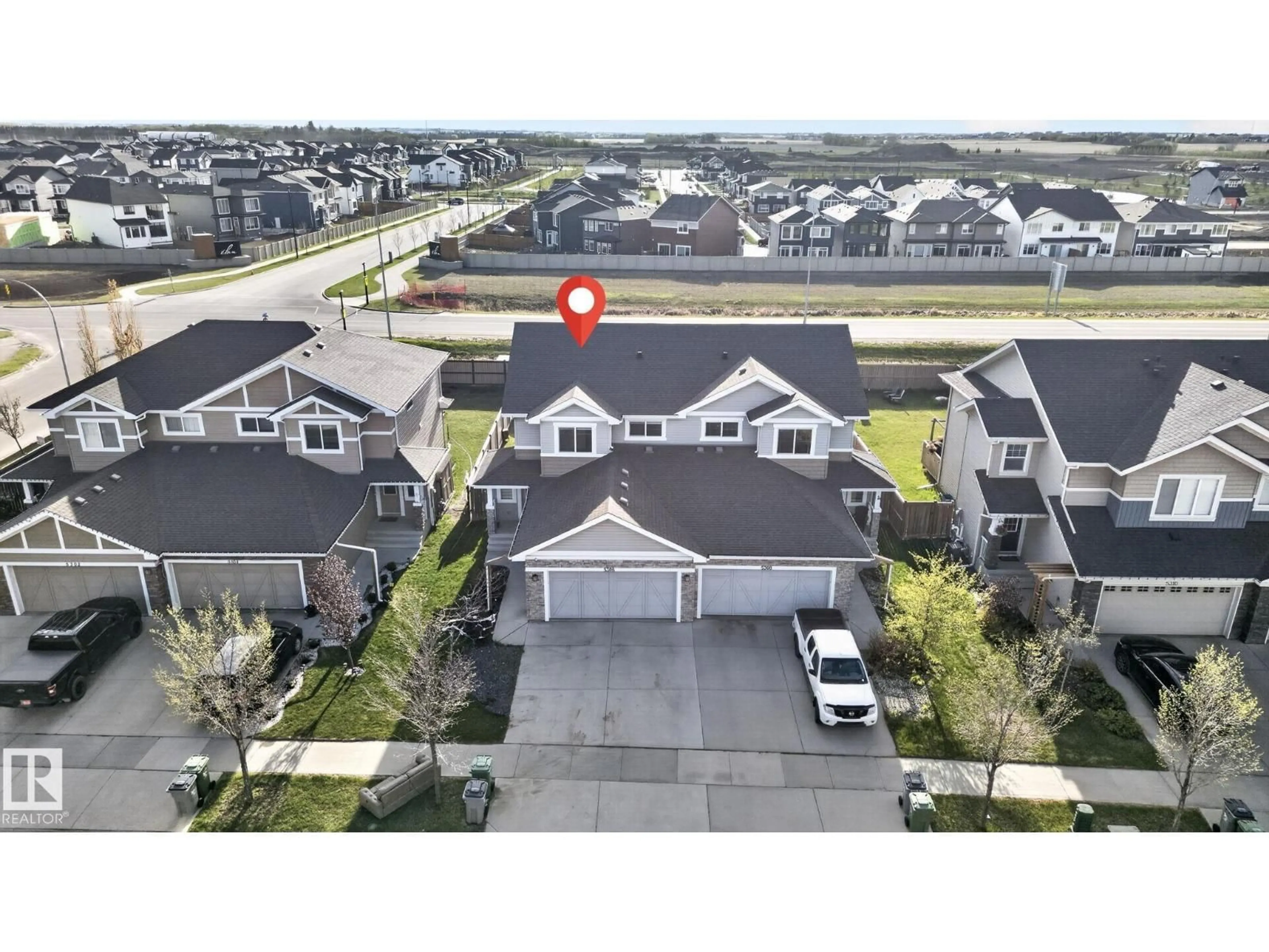 A pic from outside/outdoor area/front of a property/back of a property/a pic from drone, street for E - 5306 67 STREET, Beaumont Alberta T4X2A2