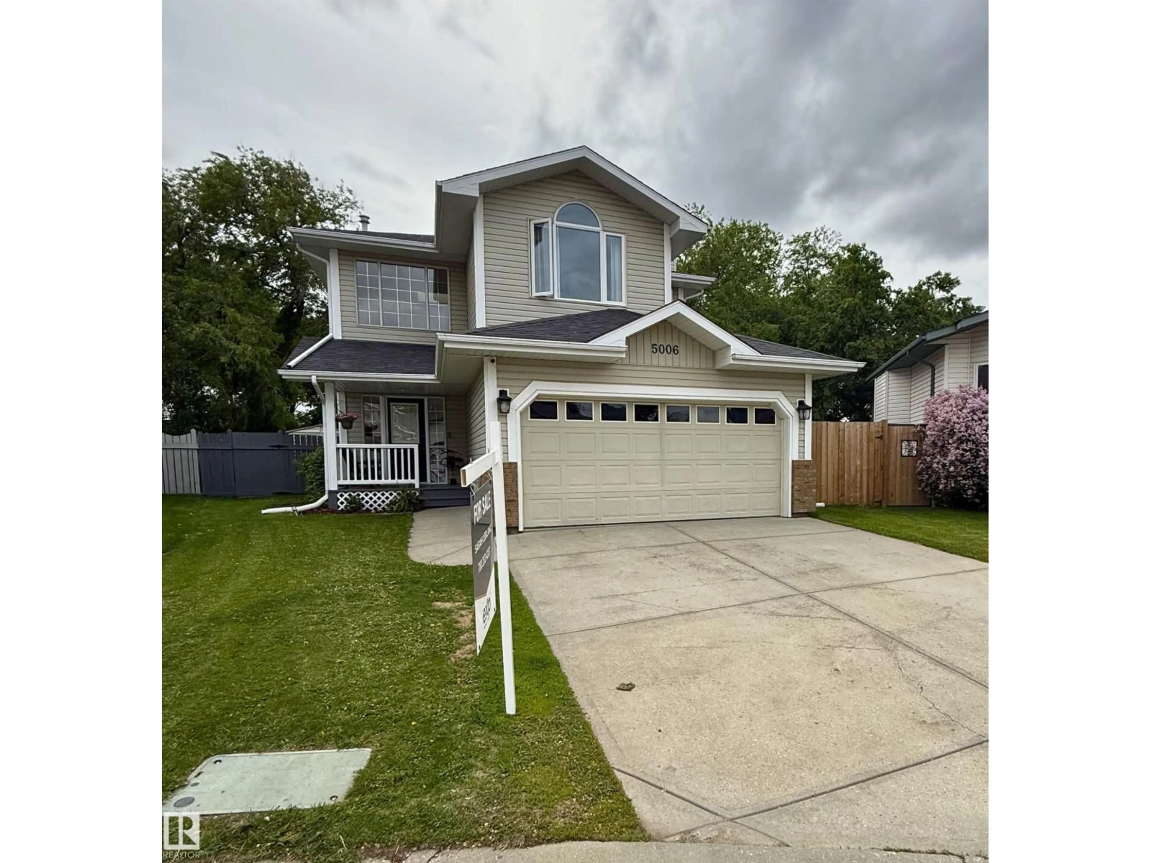 Home with vinyl exterior material, street for 5006 59 ST, Beaumont Alberta T4X1B7