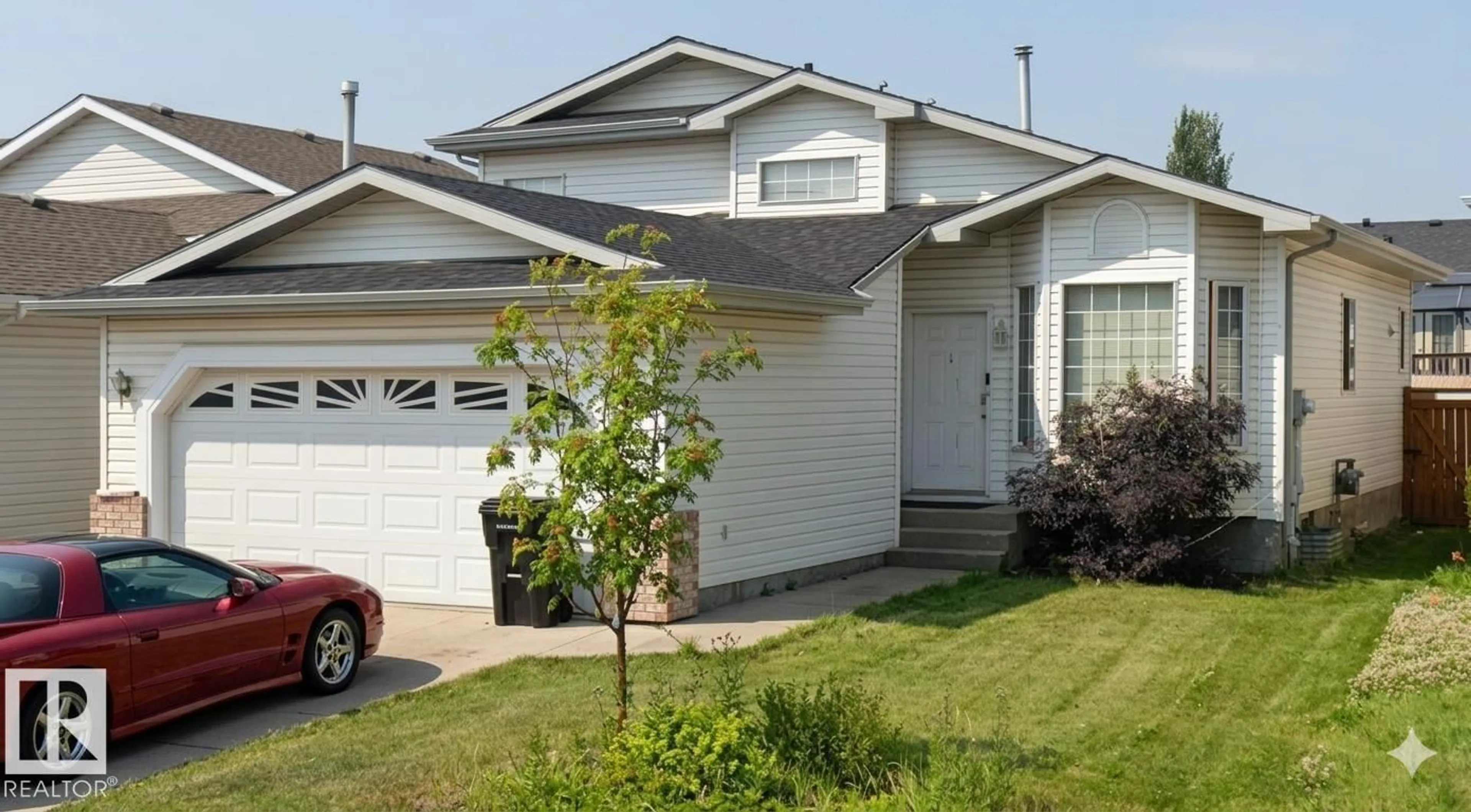 Home with vinyl exterior material, street for 1188 JOYCE RD, Edmonton Alberta T6L6V4