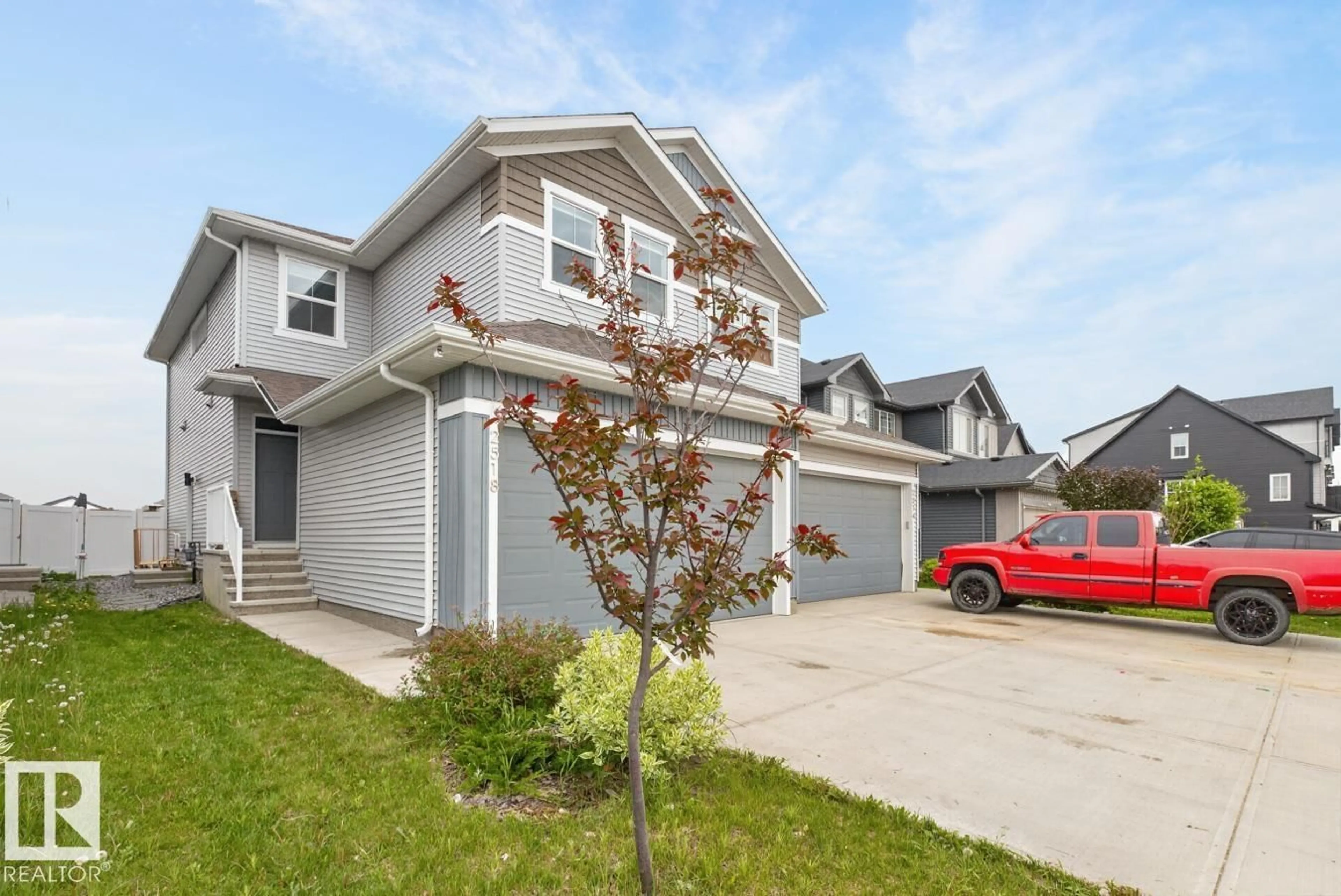 Home with vinyl exterior material, street for 2514 151A AV, Edmonton Alberta T5Y3Z2